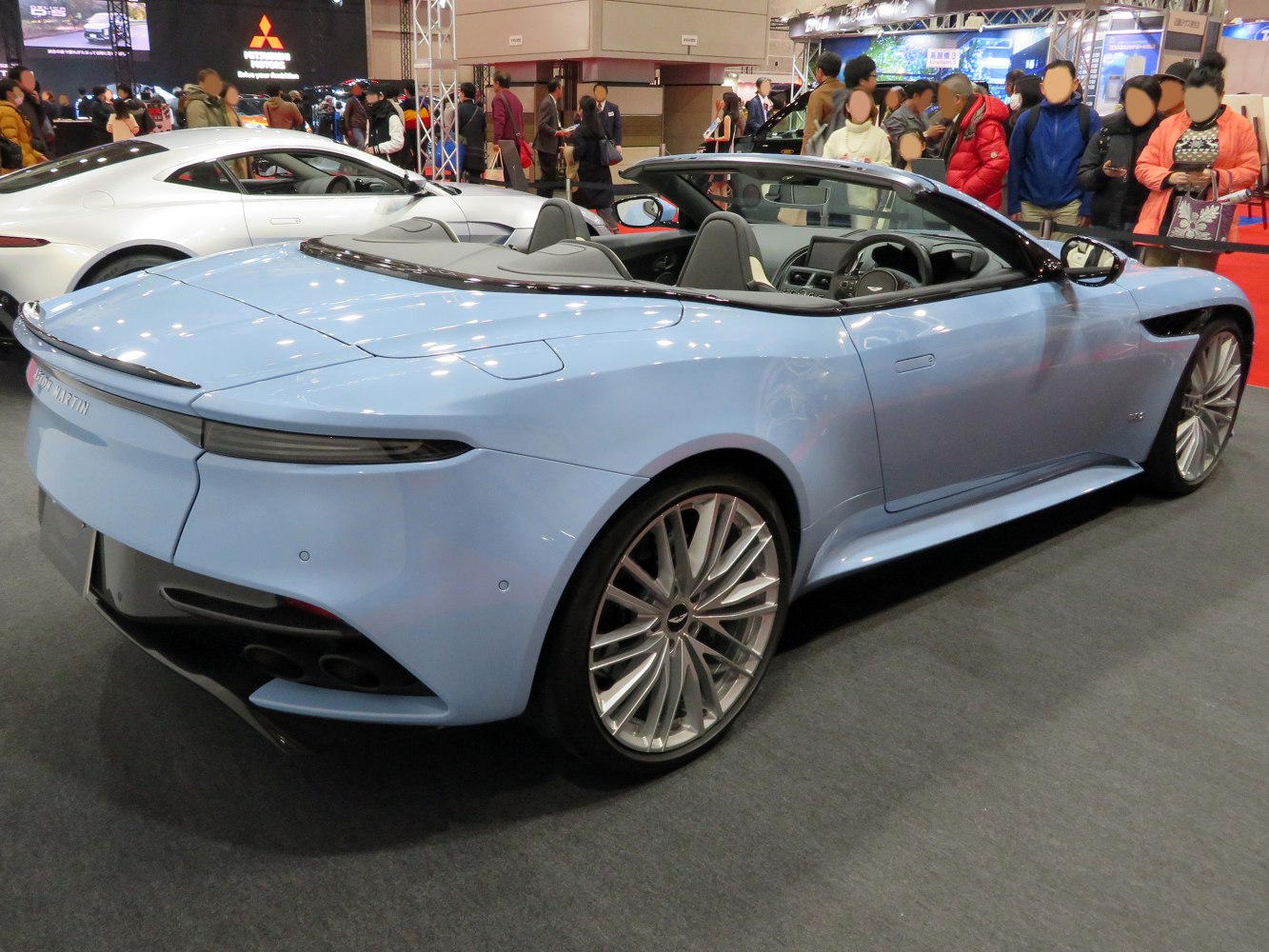 Convertible luxury sports vehicle rear and side view with aerodynamic design