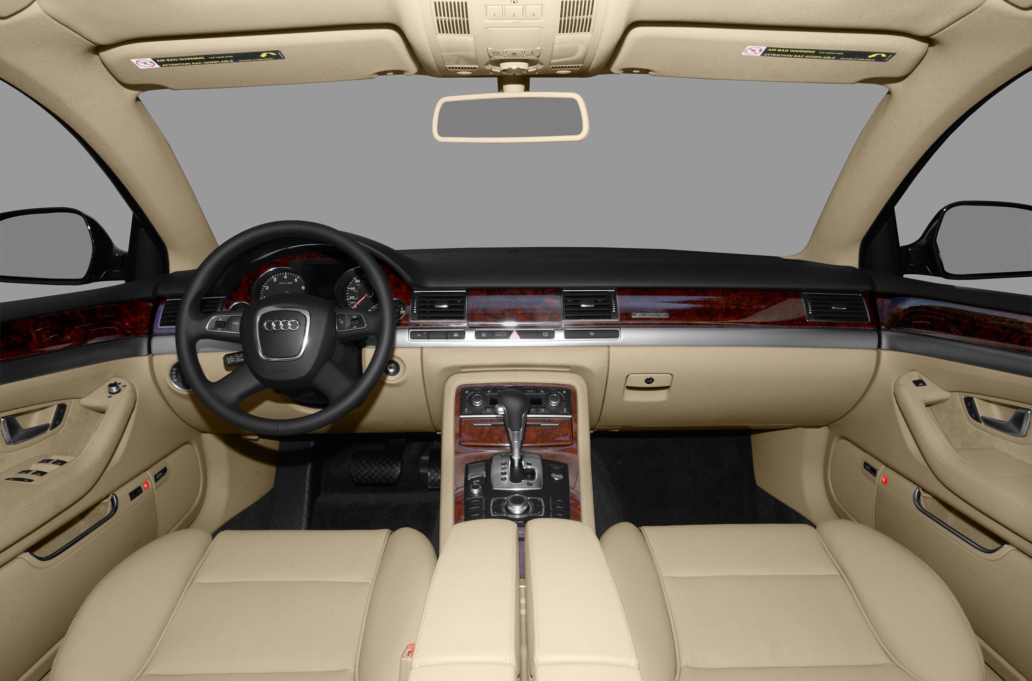 Beige leather seats with wood-trimmed dashboard and automatic gear selector