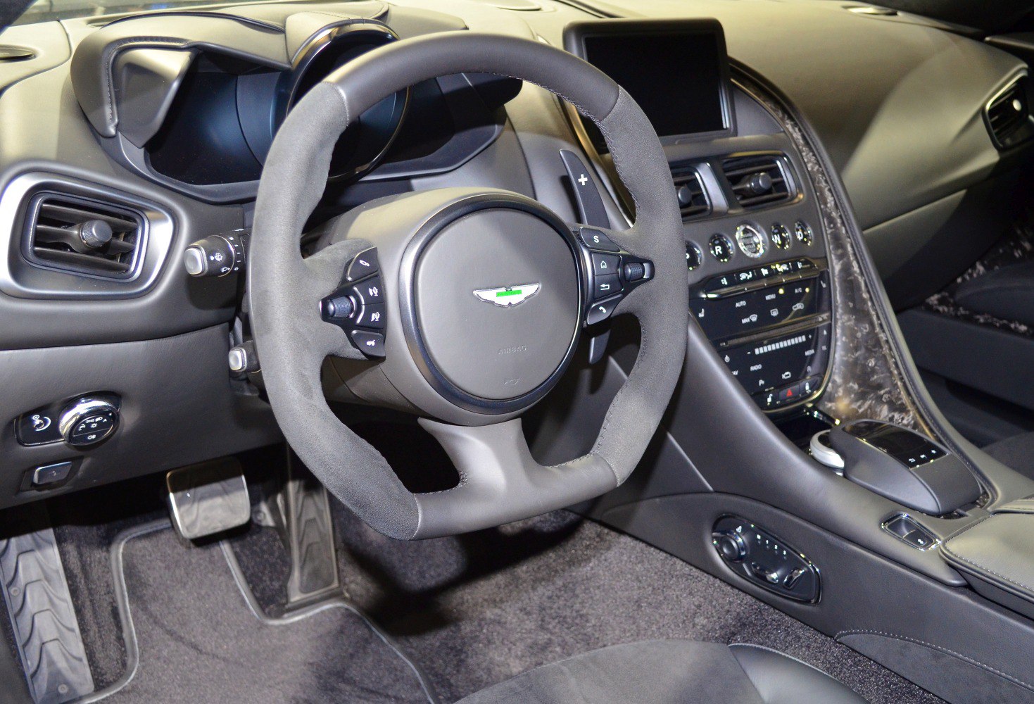 Luxurious steering wheel and dashboard with advanced controls and premium materials
