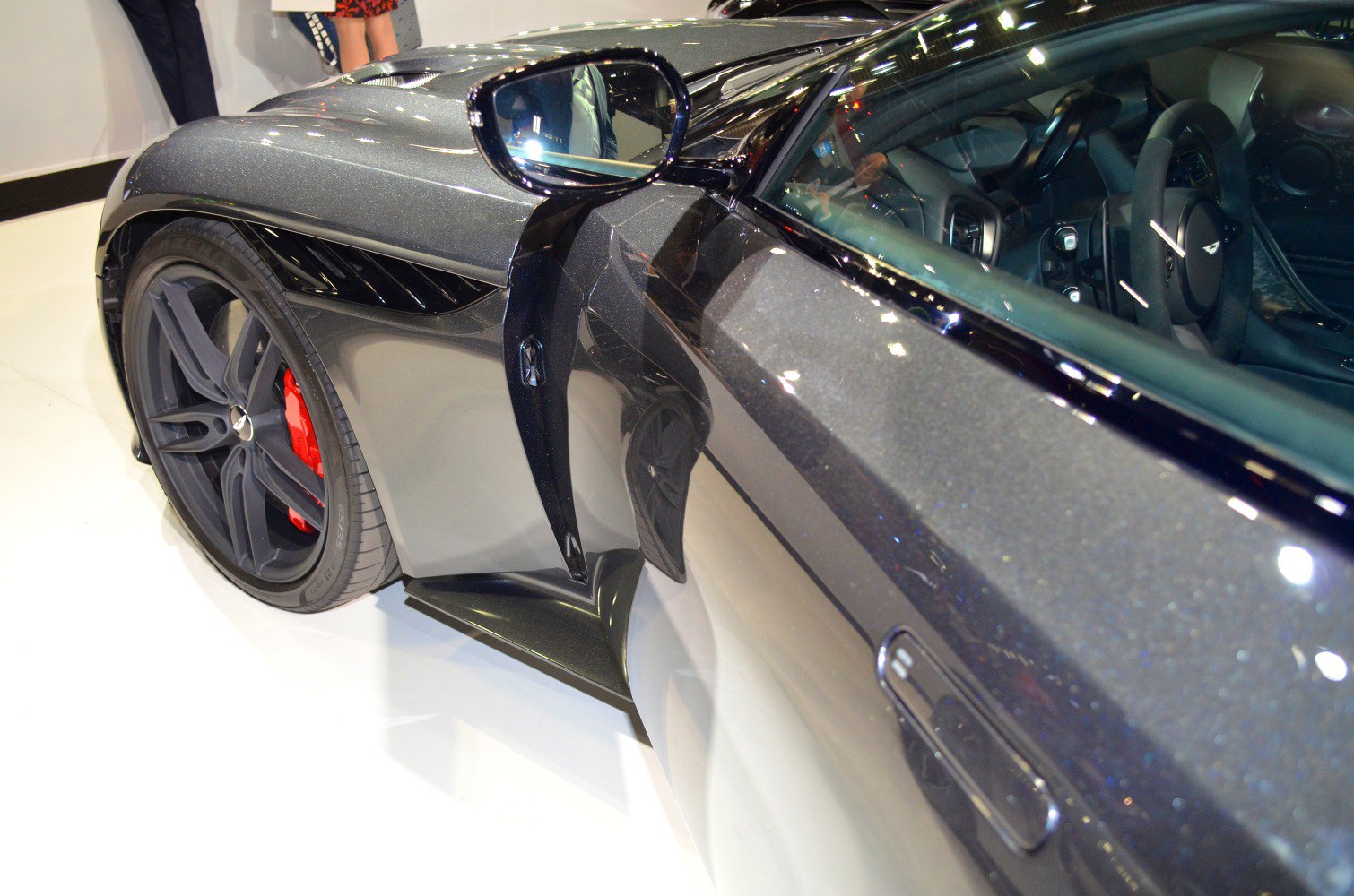 Sporty side vent and matte black wheel with red brake caliper