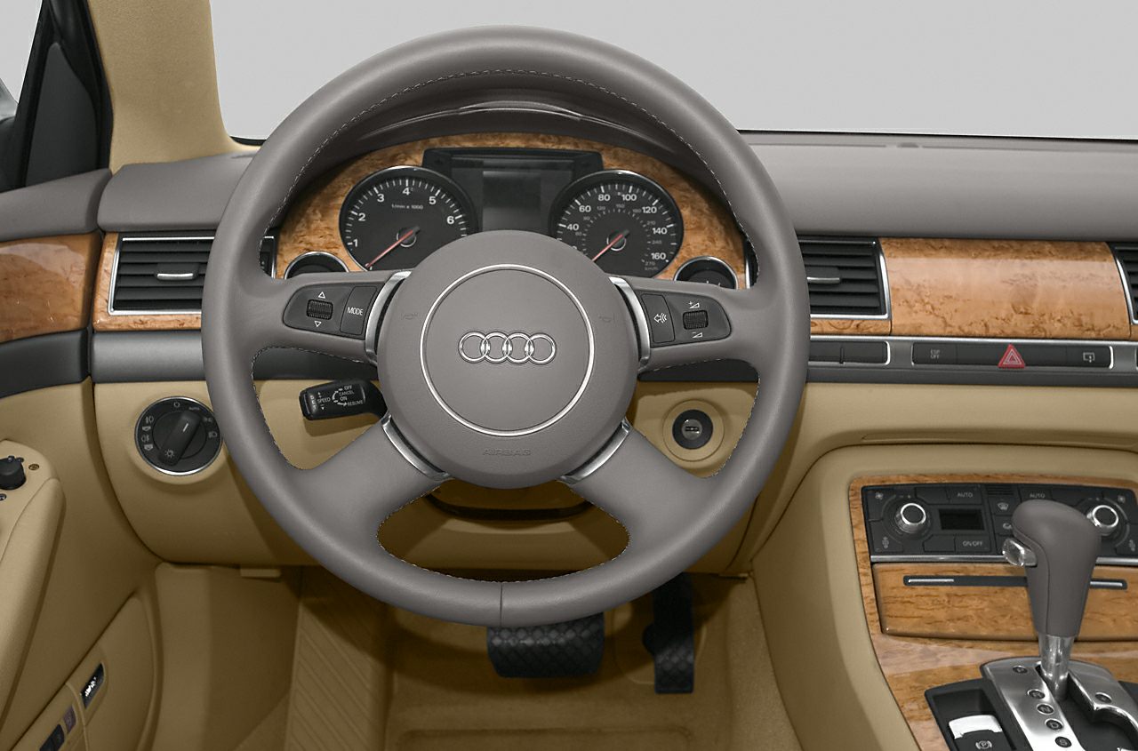Wood trim luxury dashboard with multifunction steering wheel and automatic gear shift
