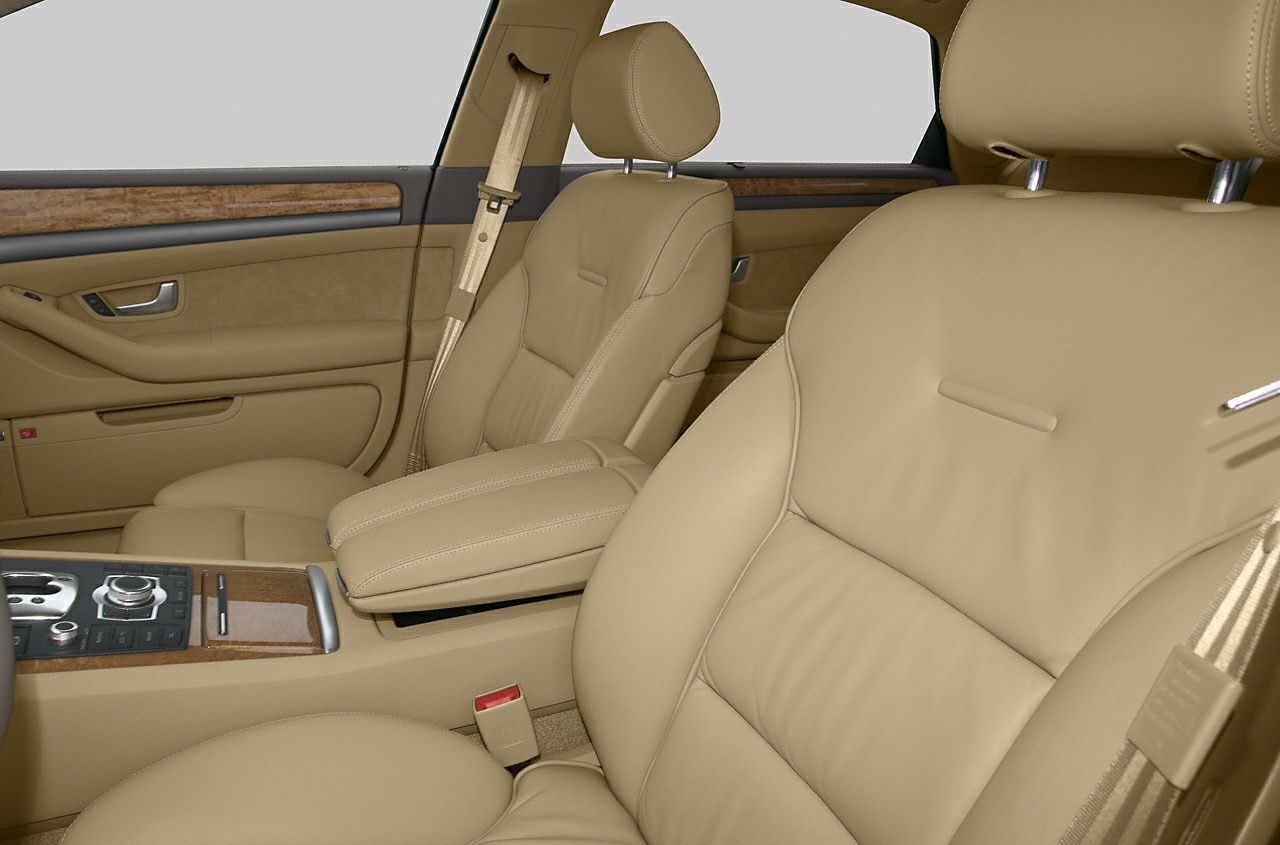 Beige leather seats with wood trim and central control panel