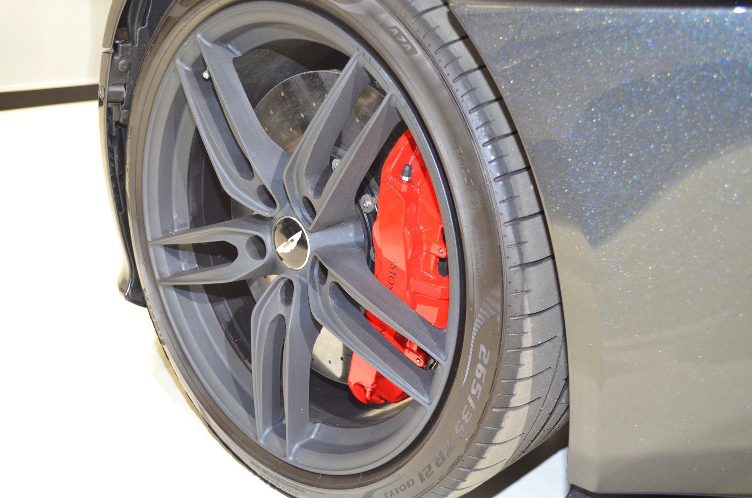 Matte black alloy wheel with red high-performance brake caliper
