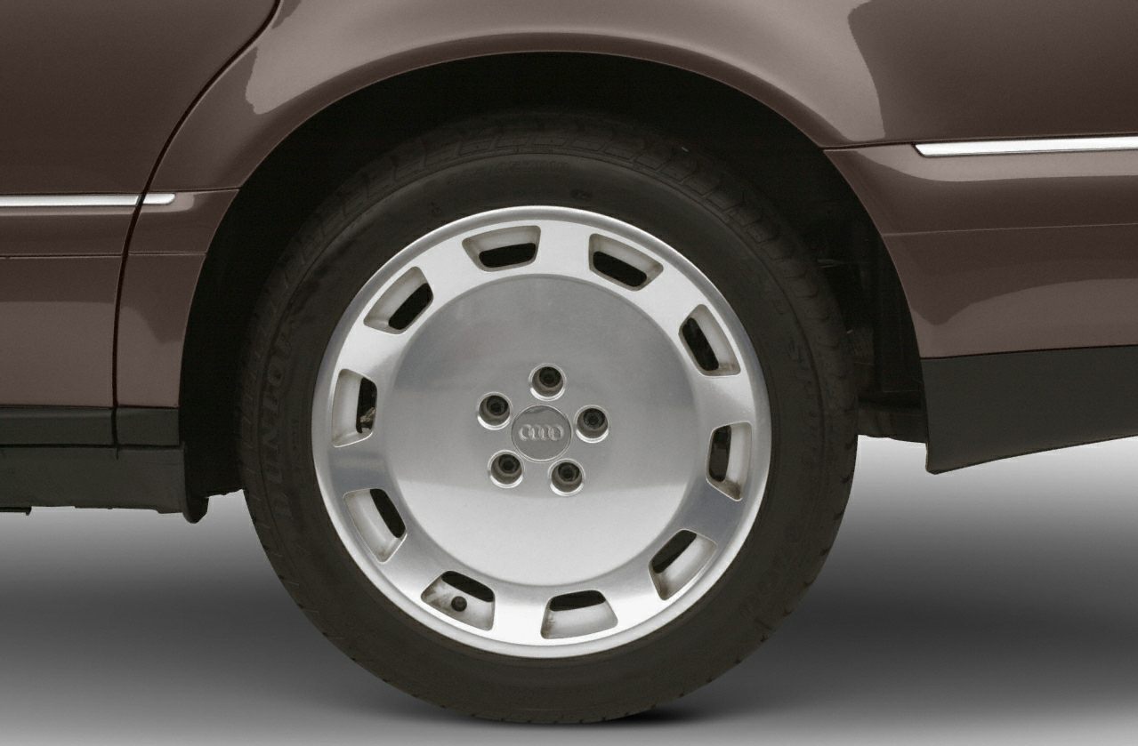 Close-up of alloy wheel and rear fender with distinctive design.