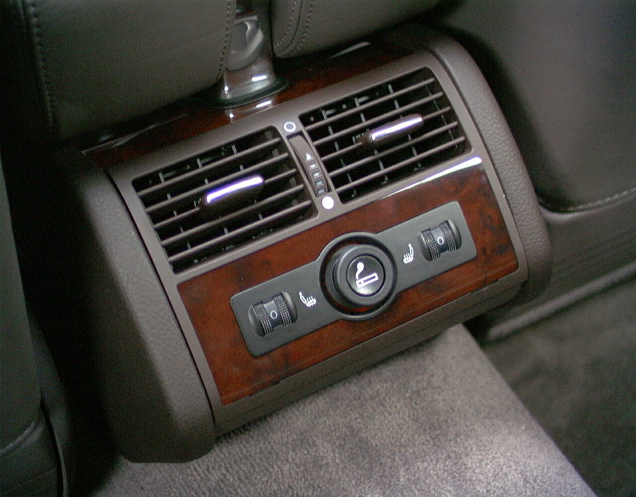 Rear seat air vents with dual heated seat controls panel
