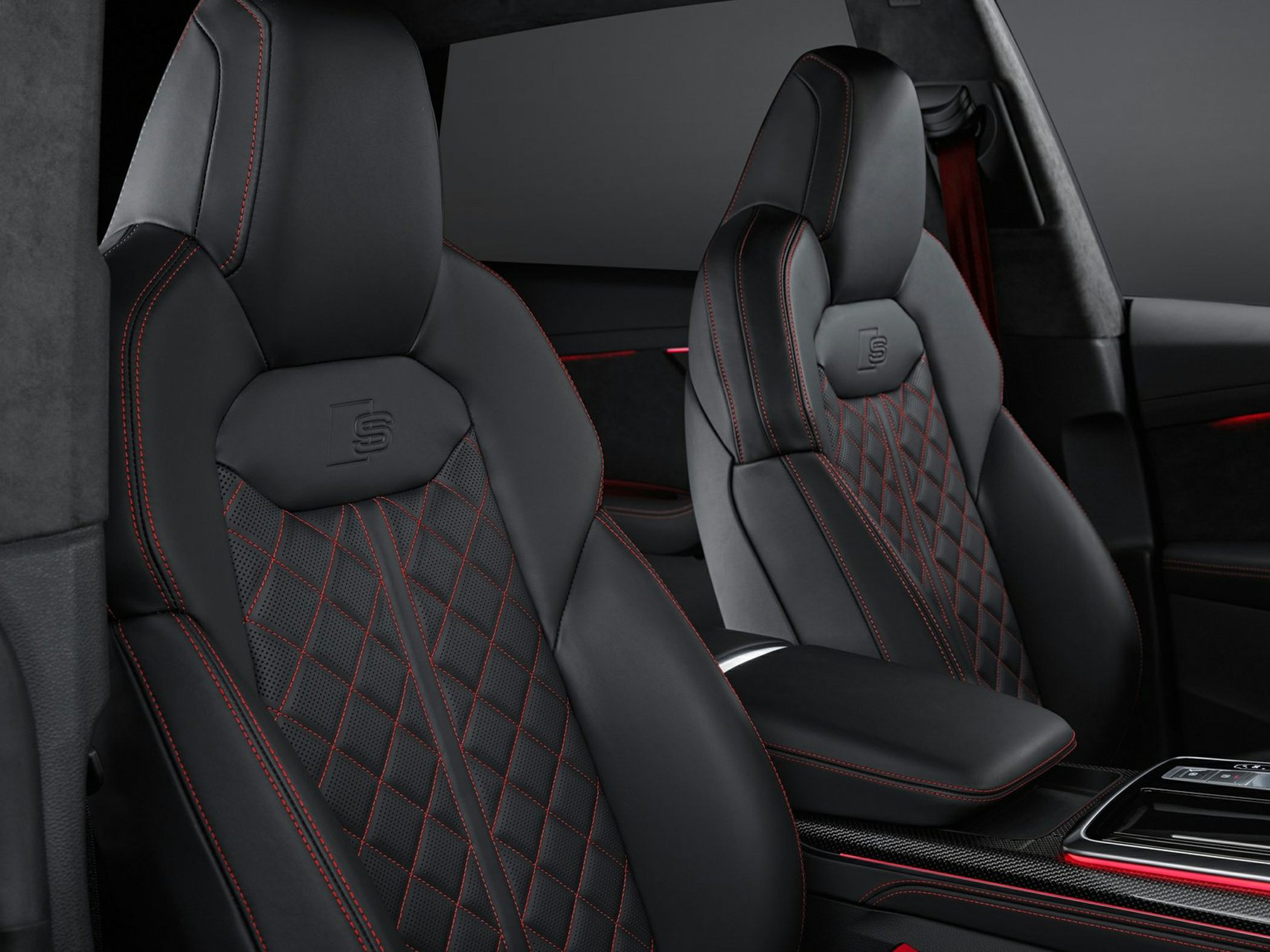 Black leather sport seats with red stitching and embossed 'S' logo