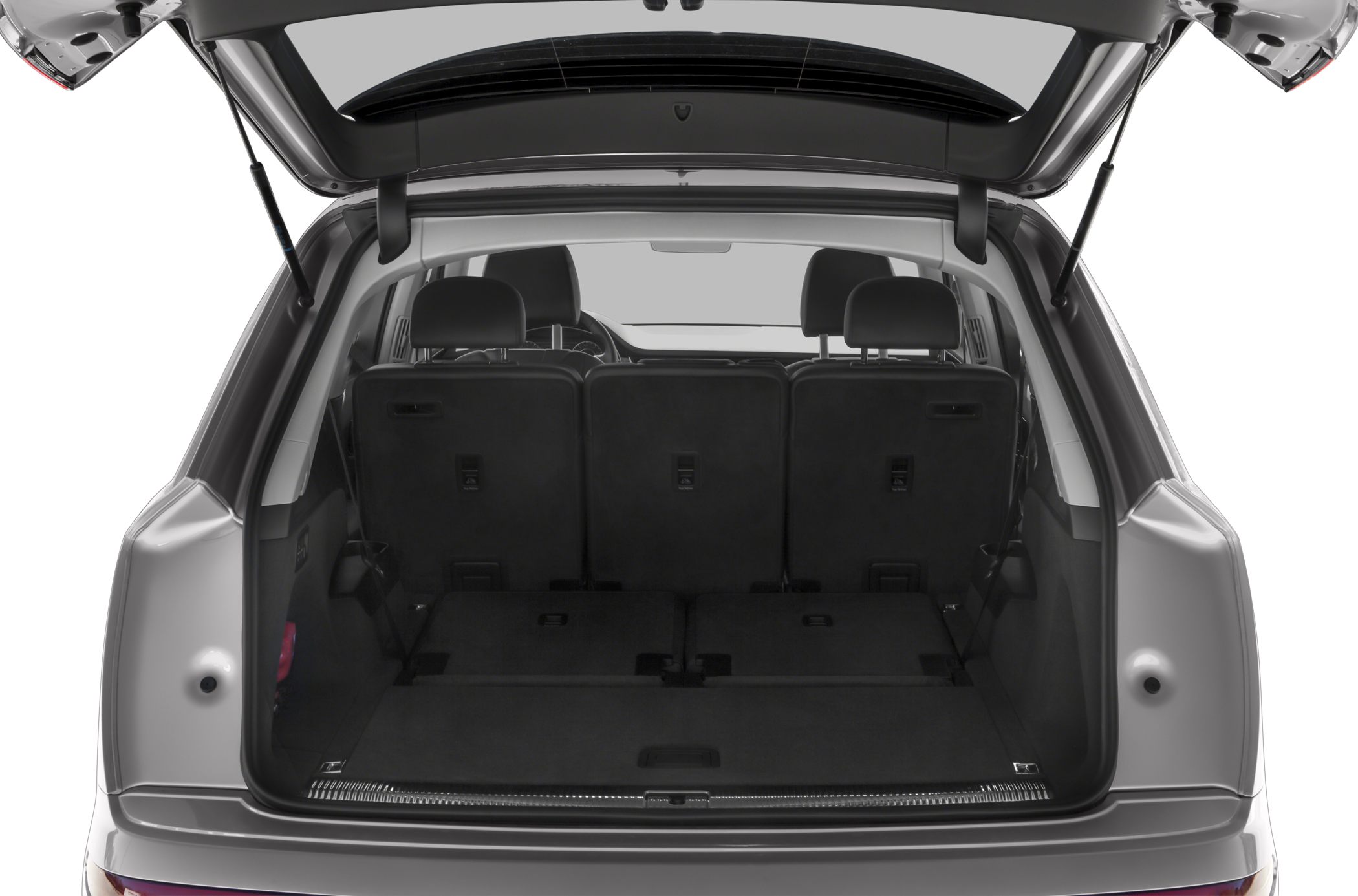 Spacious rear cargo area with folded seats in an SUV.