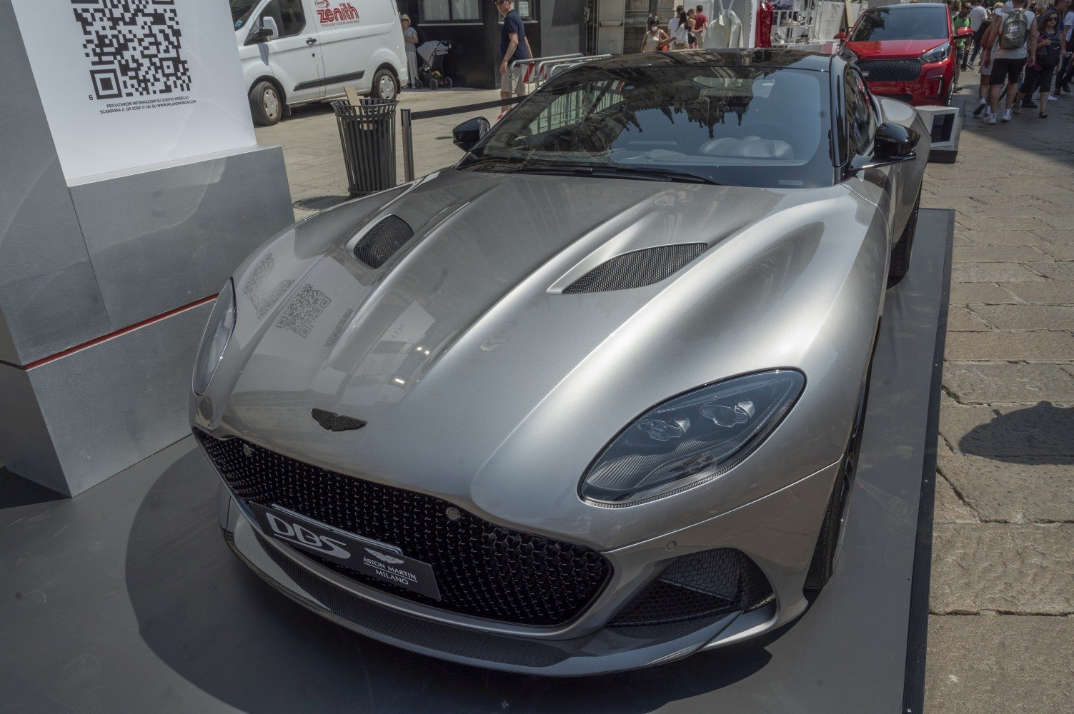 Front hood with vents and sharp headlights of a luxury sports car