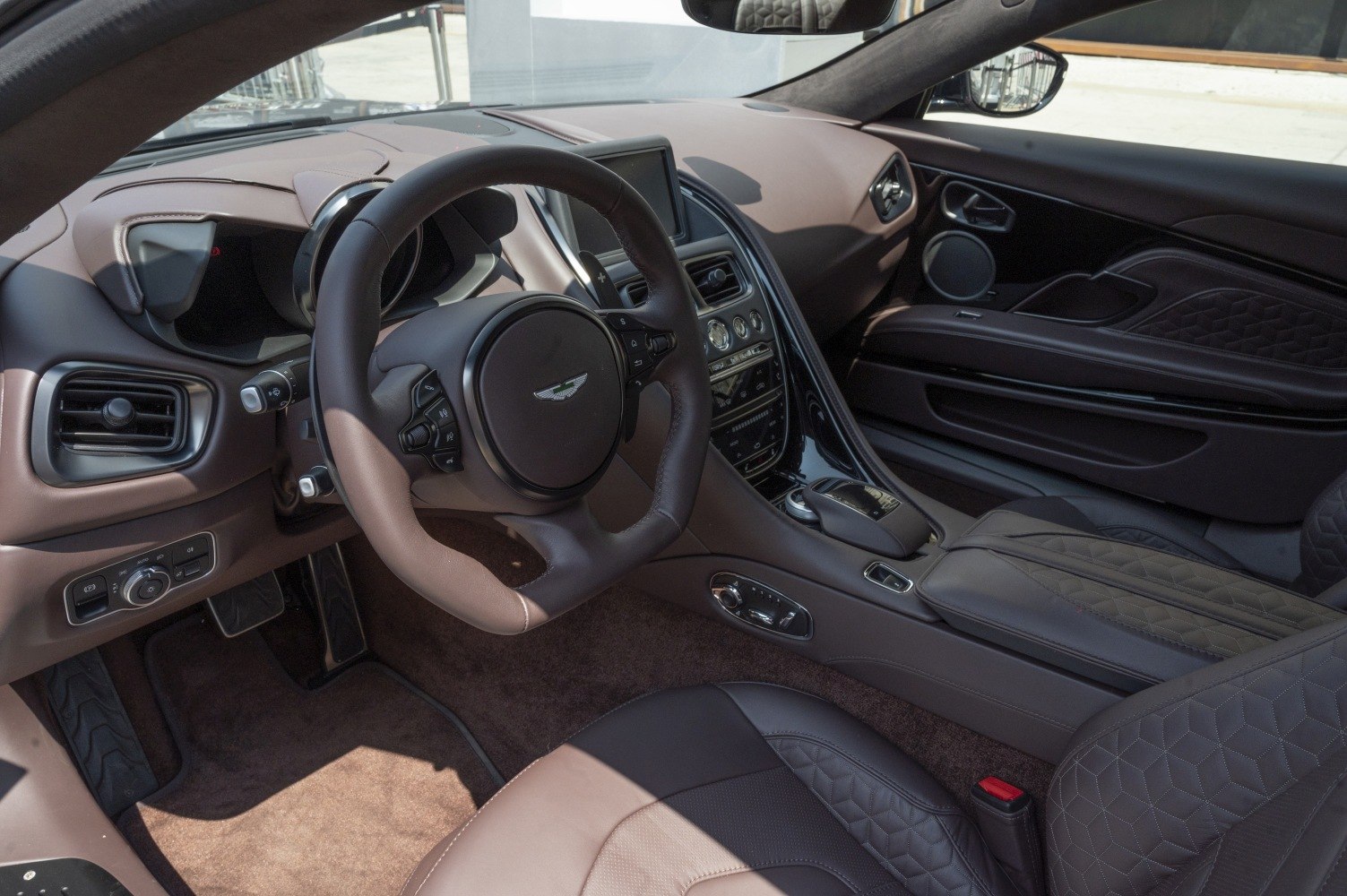 Luxury steering wheel and quilted leather interior with advanced dashboard controls