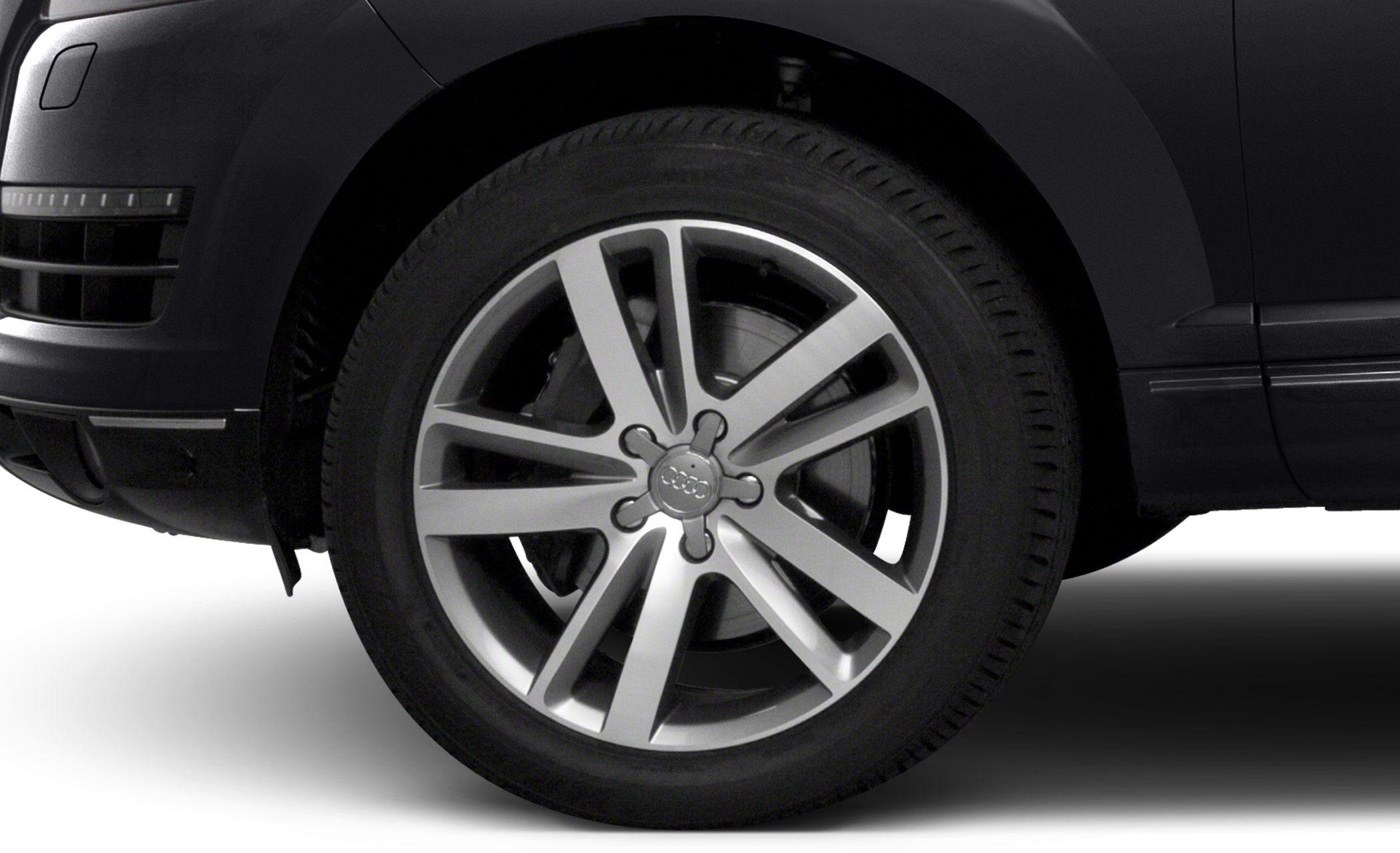 Close-up of alloy wheel and tire fitted on a dark-colored SUV