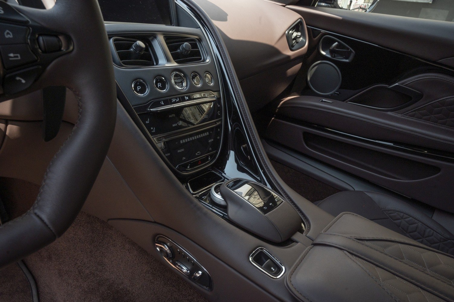 Luxury leather interior, detailed dashboard, and center console design