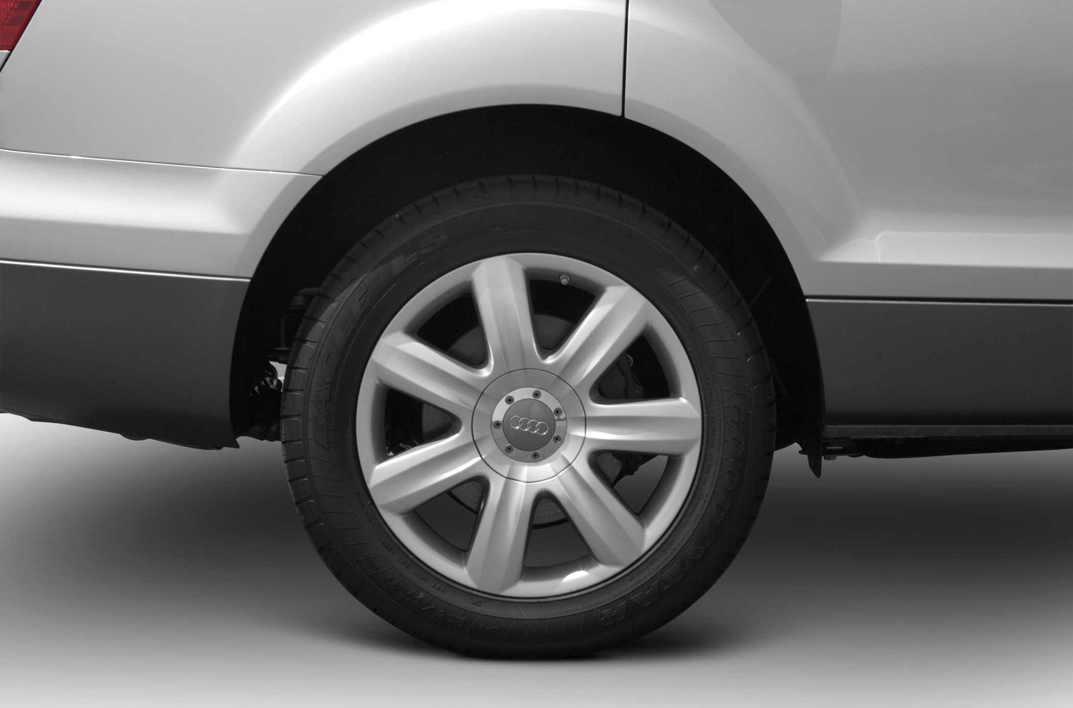 Close-up of alloy wheel and tire sidewall.