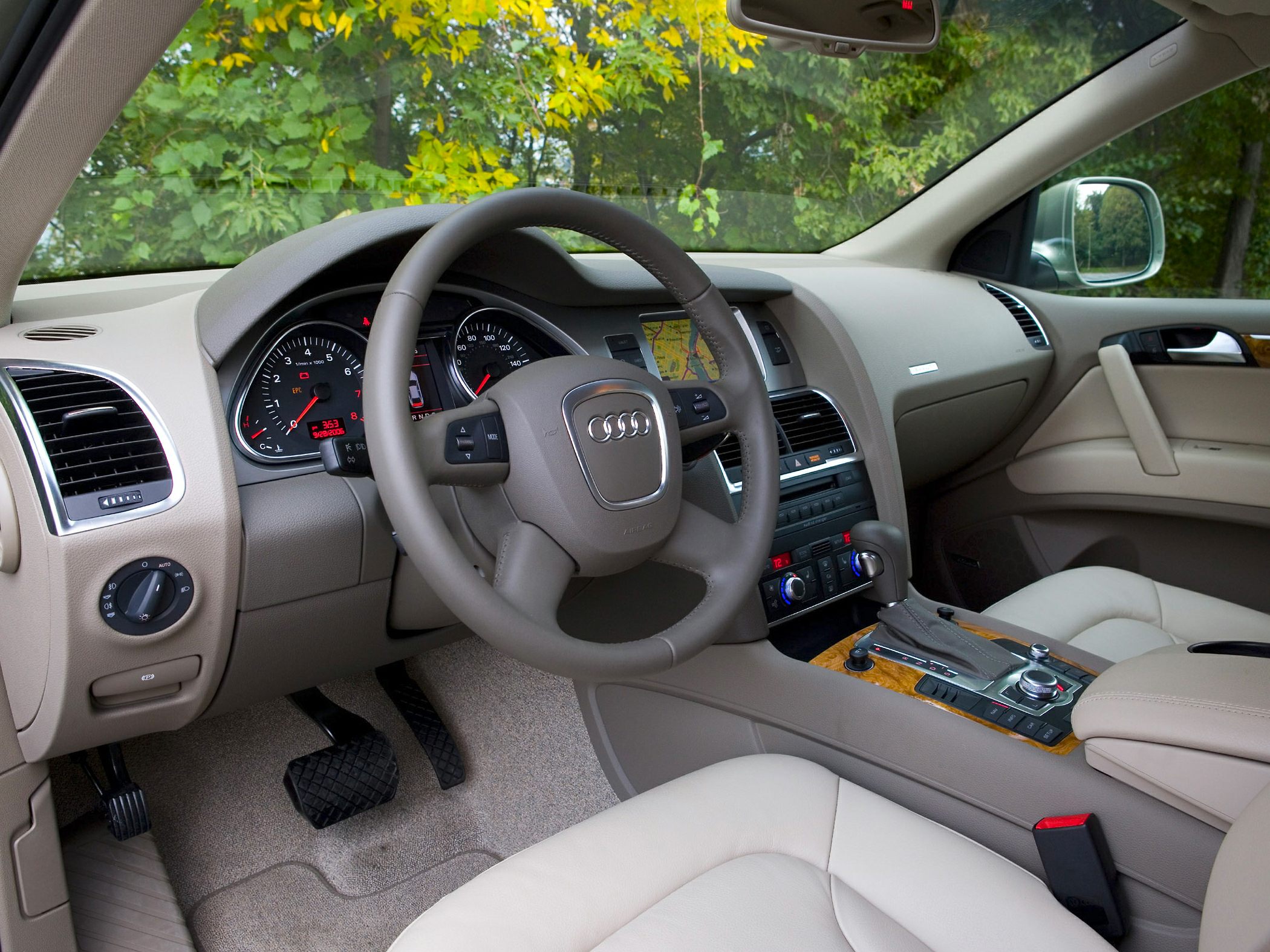 Beige leather interior with steering wheel and dashboard