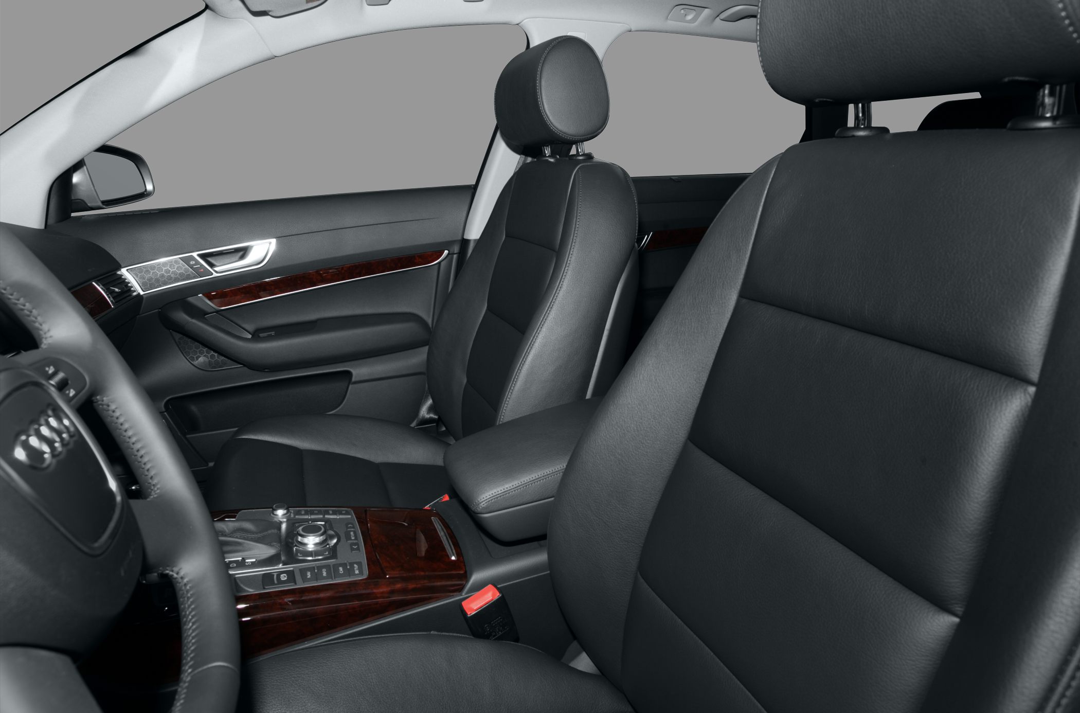 Black leather seats and wood trim in vehicle interior