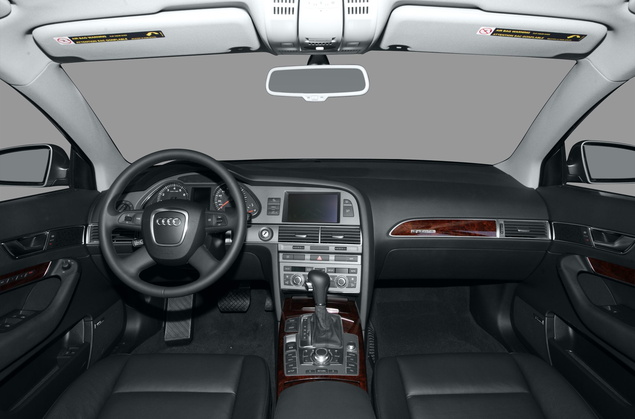 Audi Q7 interior dashboard and center console with wood trim and steering wheel.