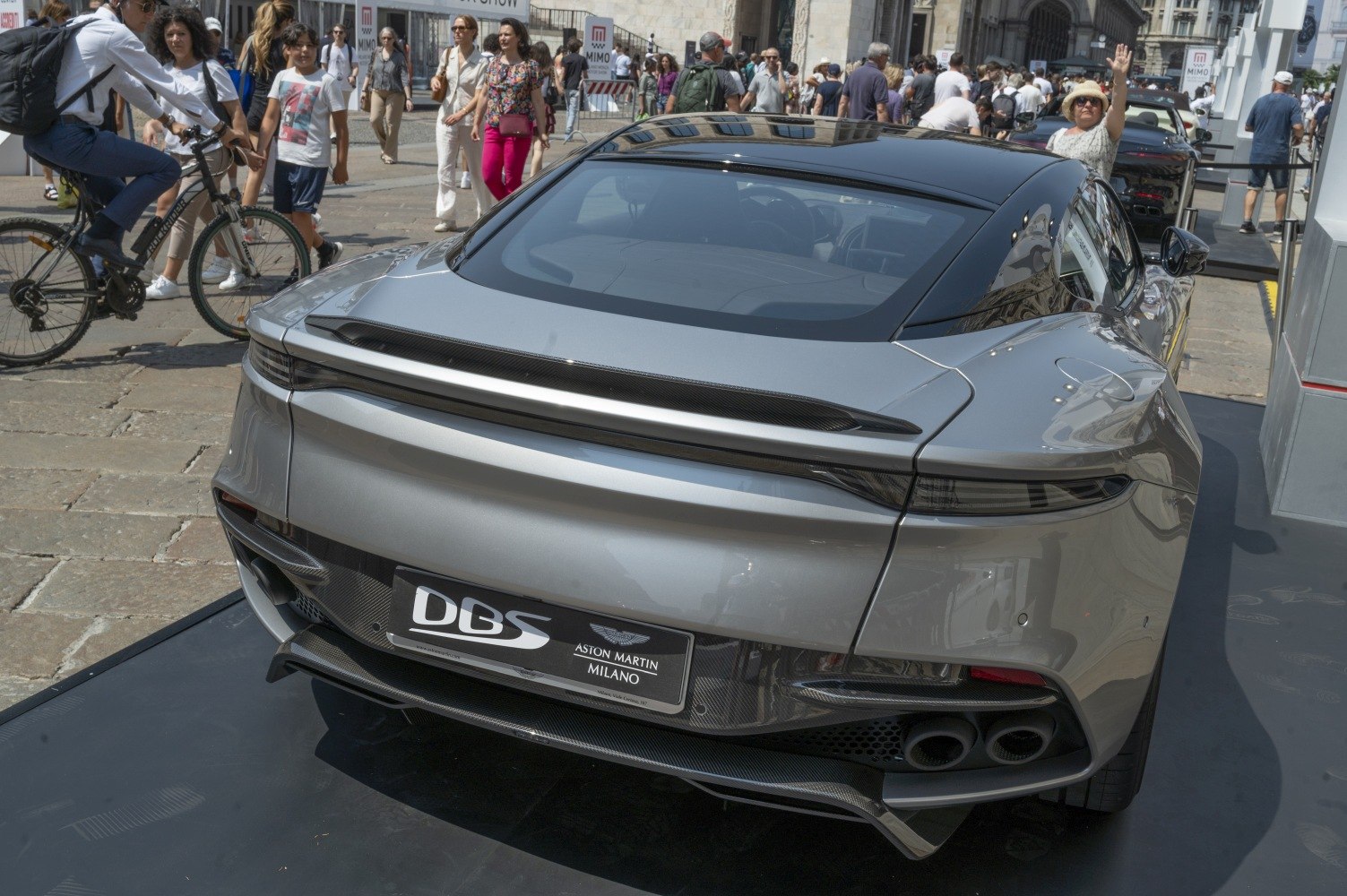 Rear view with spoiler, quad exhaust, diffuser, and aerodynamic taillights