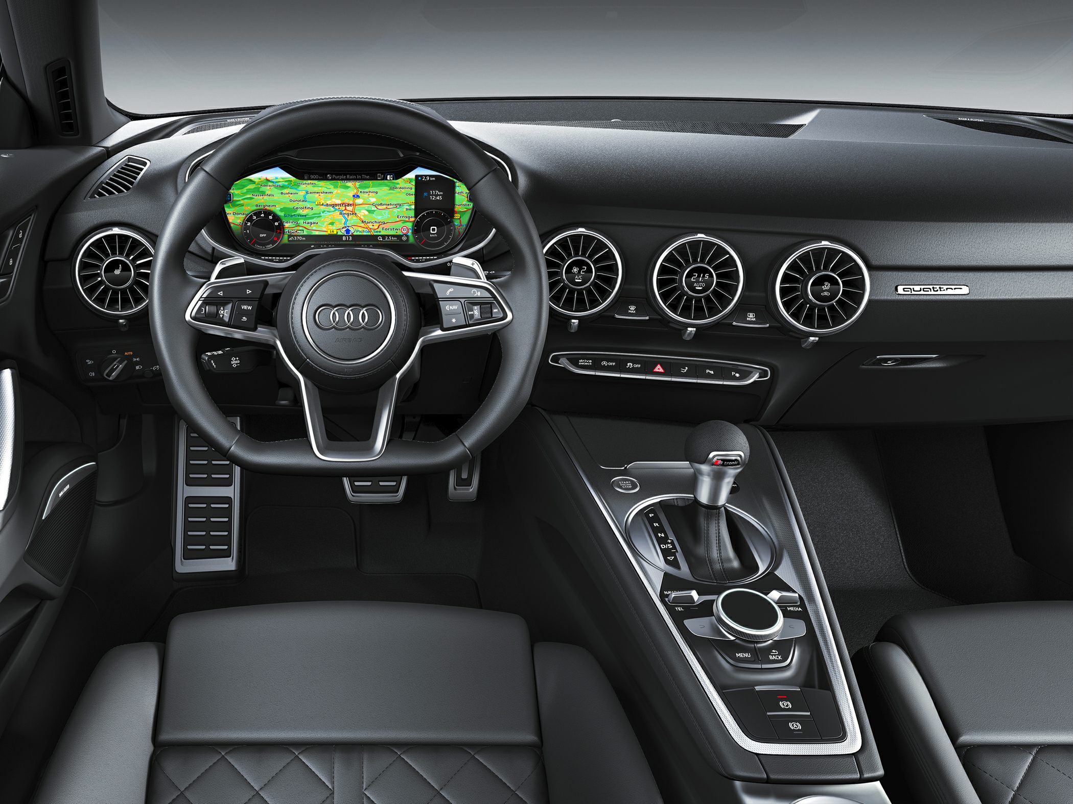Digital cockpit and circular air vents with sporty center console.