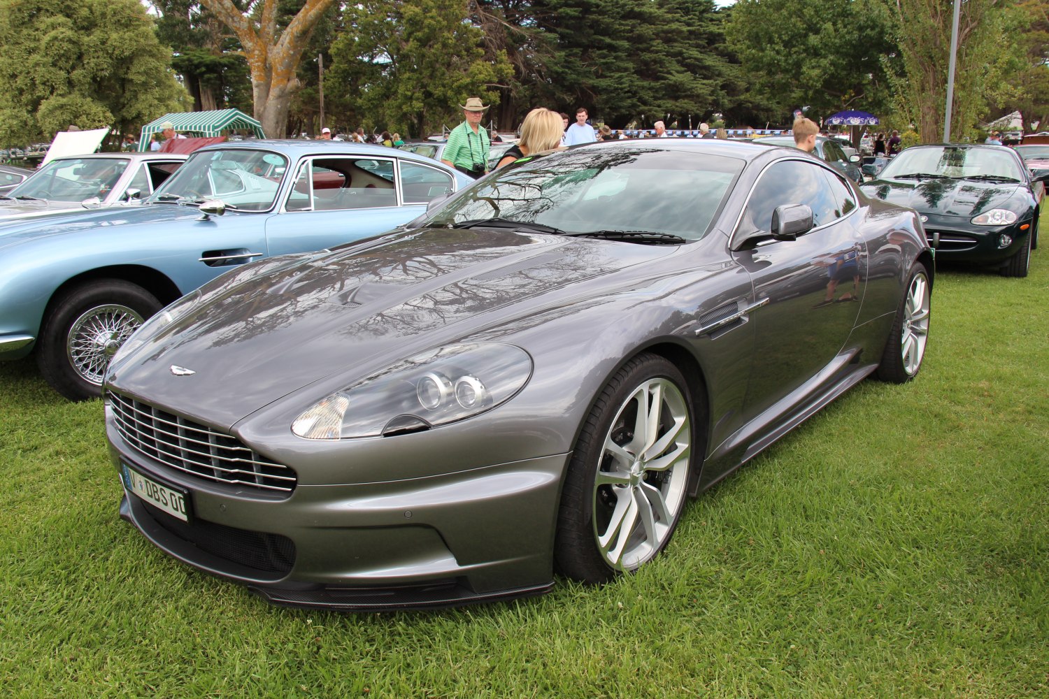 Front view of a sleek sports coupe with distinctive headlights and alloy wheels.