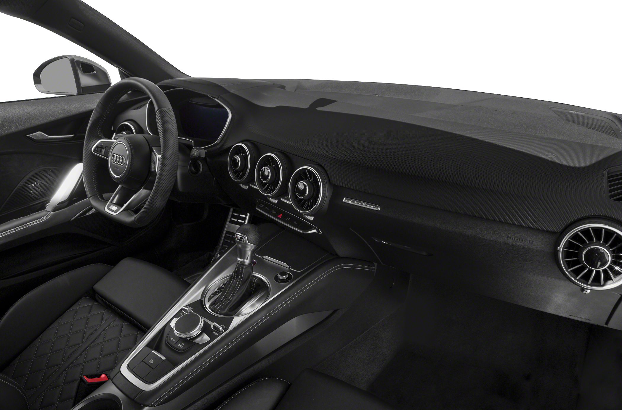 Audi dashboard with digital cockpit, circular air vents, and center console with automatic gear lever