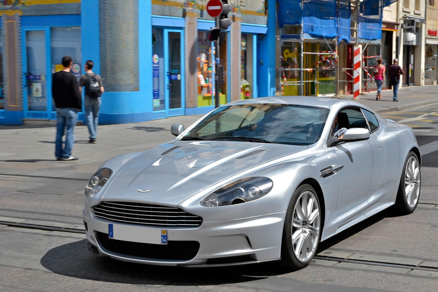 Silver sports coupe with sharp headlights and prominent front grille