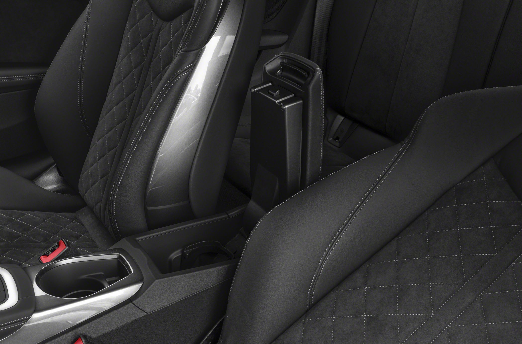 Quilted leather seats with contrast stitching and a center armrest console.