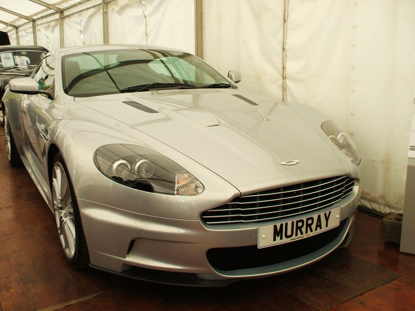 Front fascia with aggressive grille and dual circular headlights.