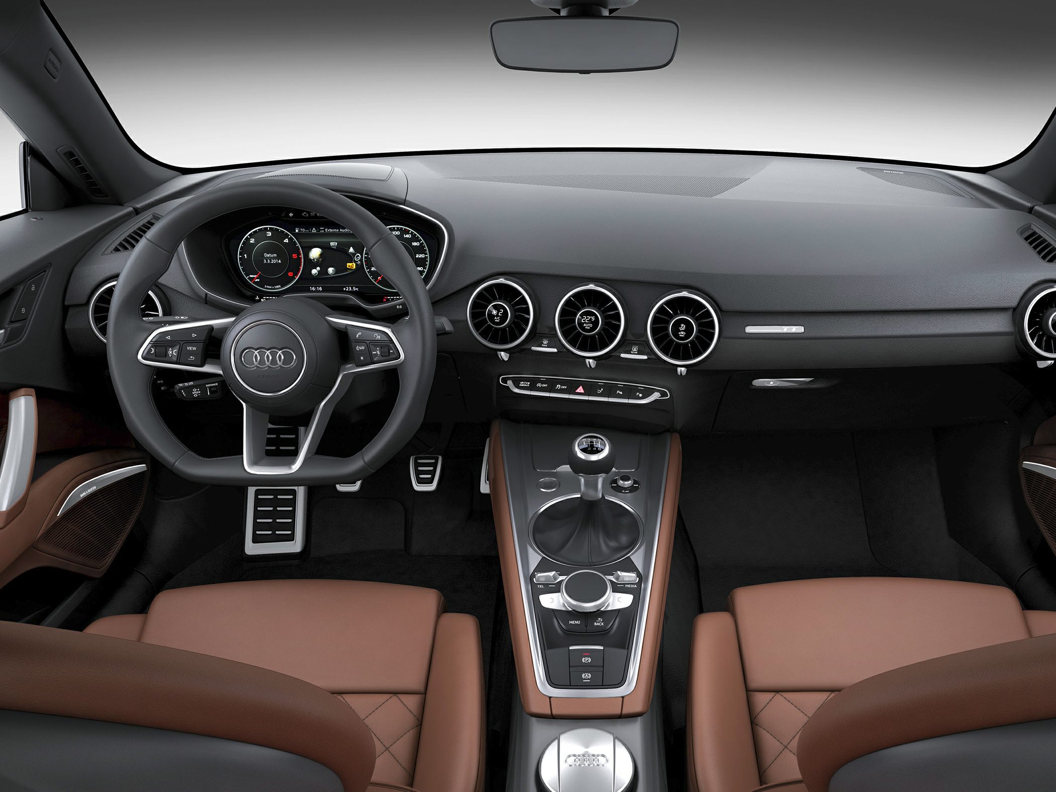 Dashboard and center console with manual gear shift and round air vents