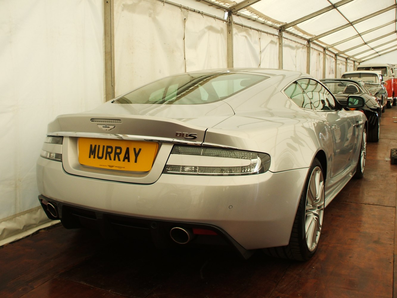 Sleek rear view with distinct tail lights and dual exhausts.