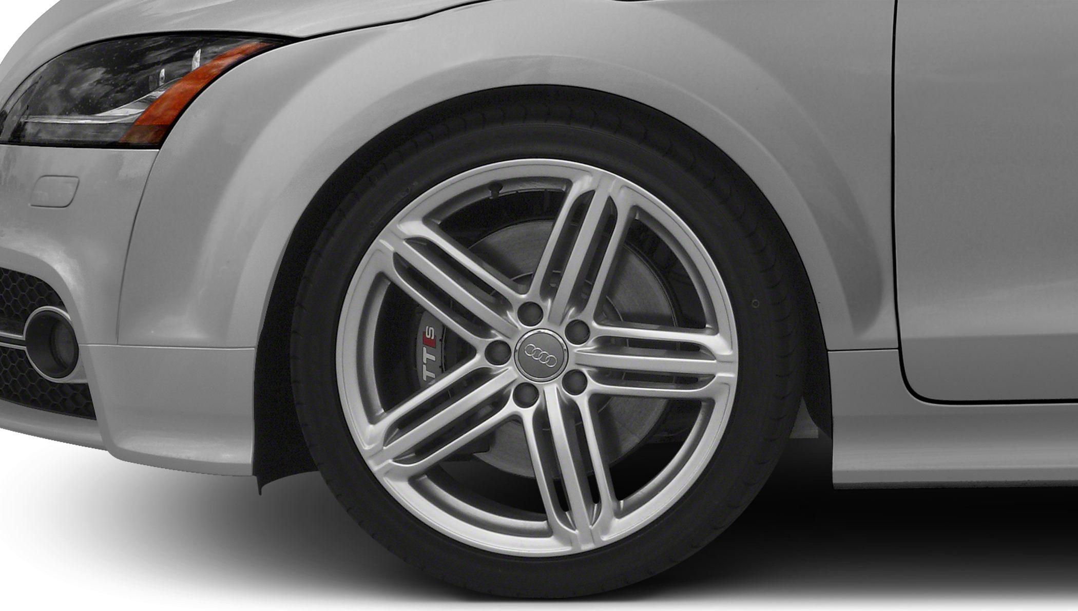 Silver alloy wheel with distinctive spoke design and TTS brake caliper.