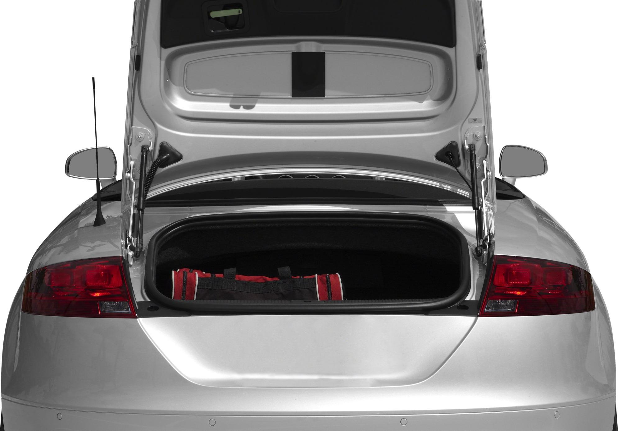 Rear trunk open with red duffel bag inside