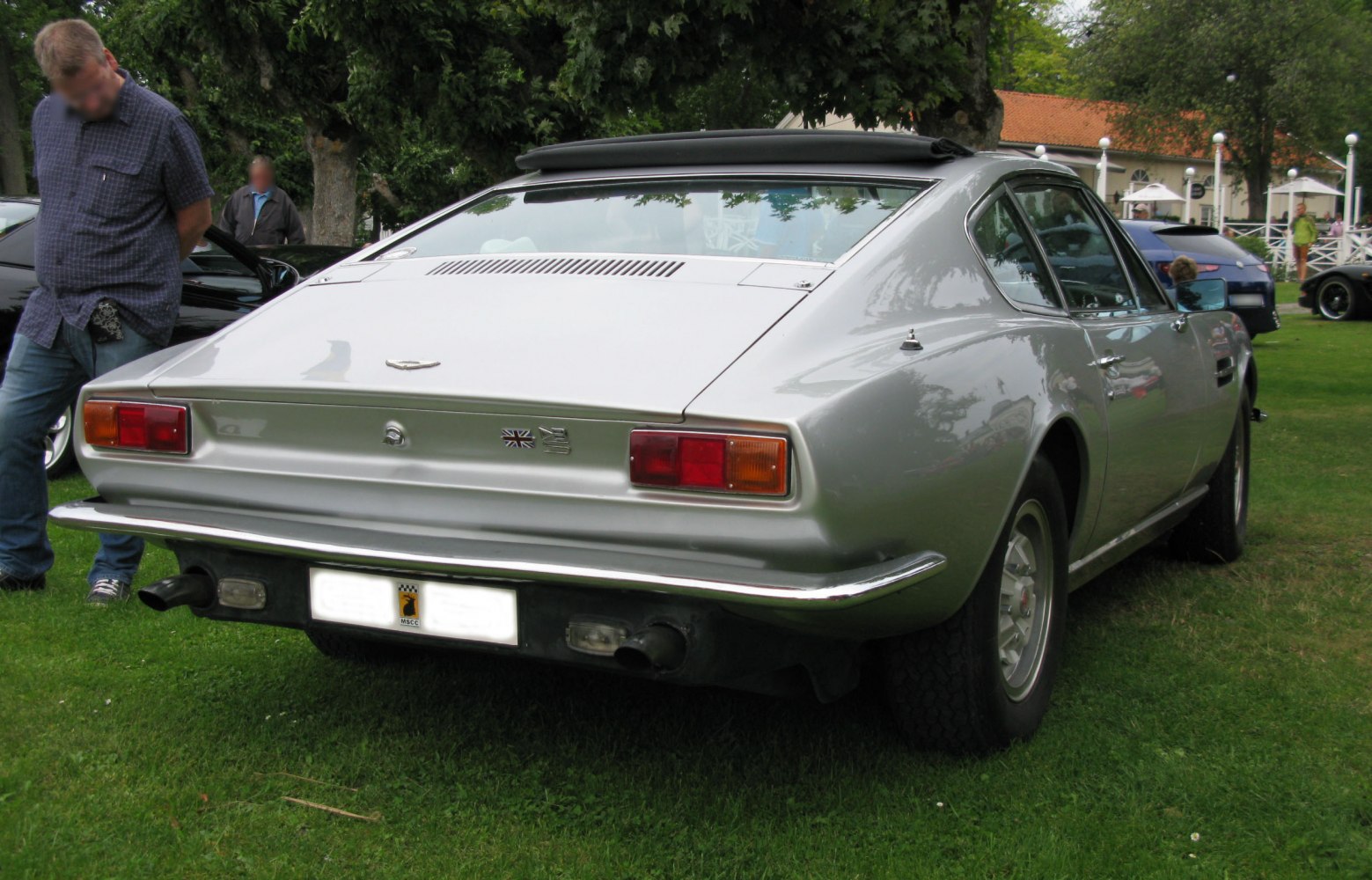 Rear view showing tail lights and rear window louvers
