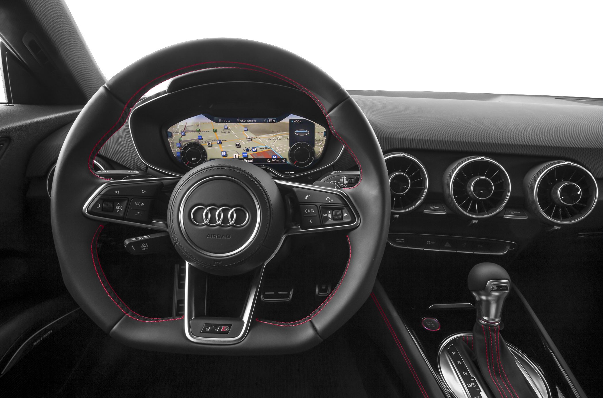 Flat-bottom steering wheel with red stitching and digital instrument cluster.