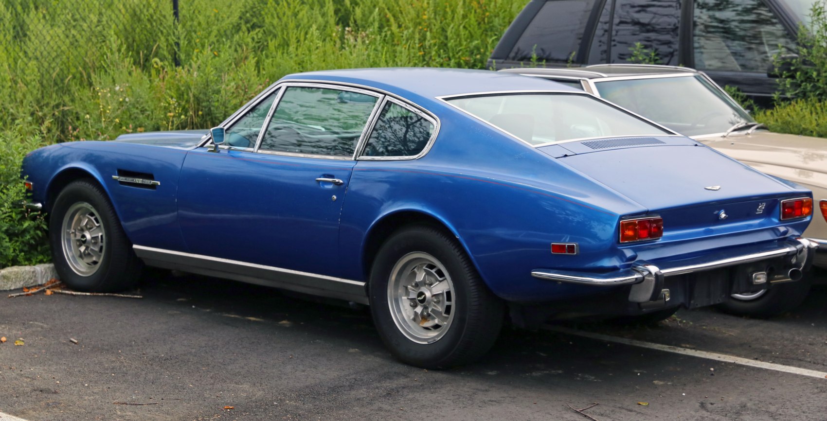 Fastback body with vintage alloy wheels in rear-side view