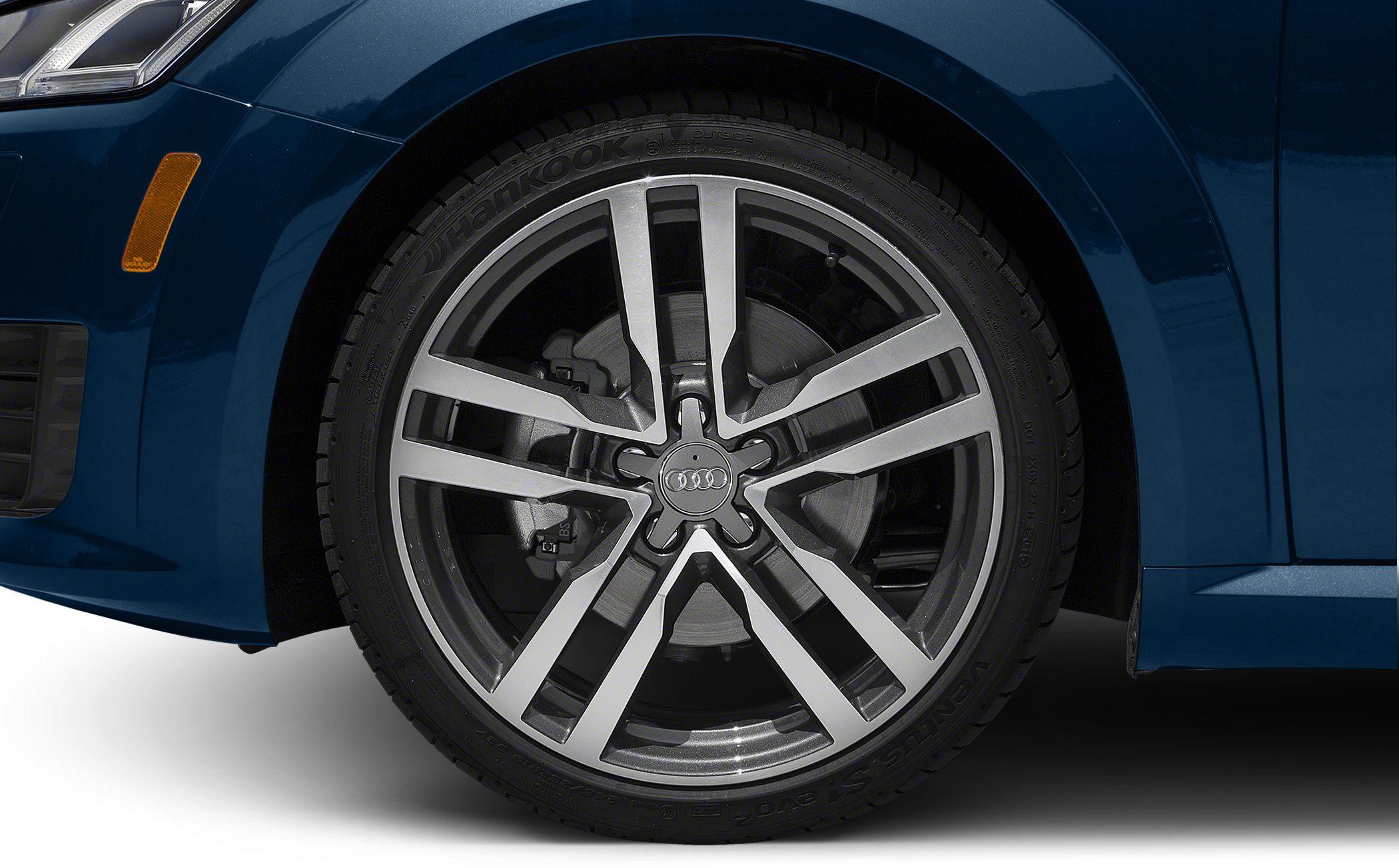 Close-up of modern alloy wheel and tire on a vehicle front side