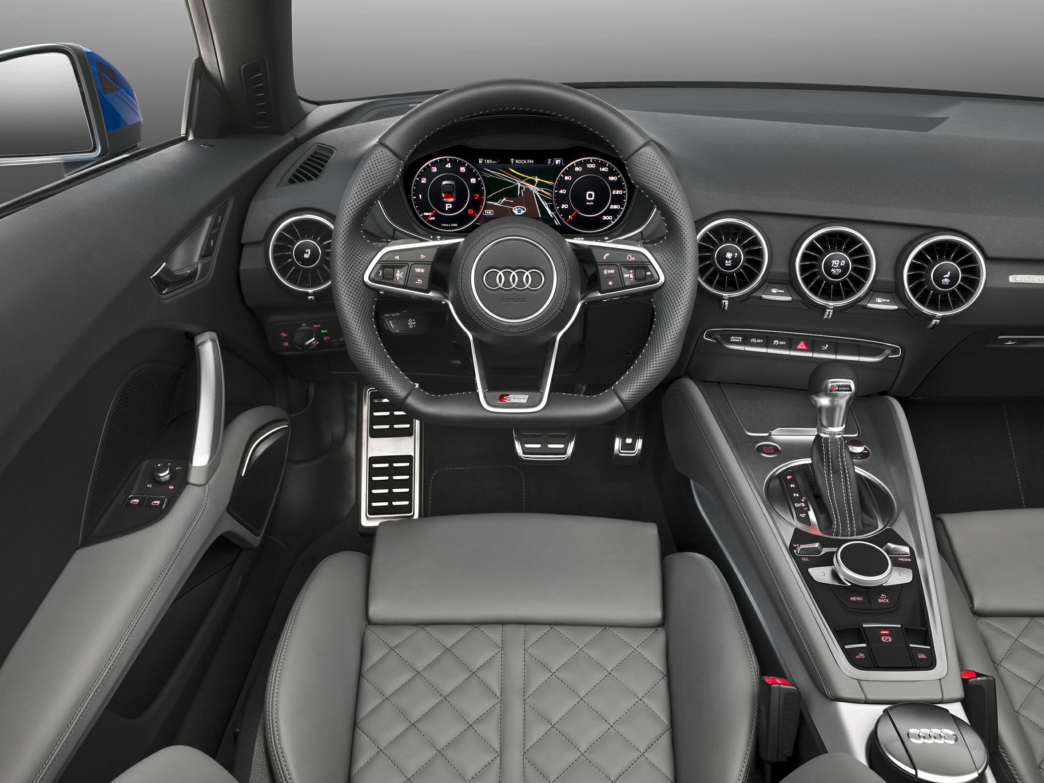Sporty steering wheel and digital dashboard with modern center console