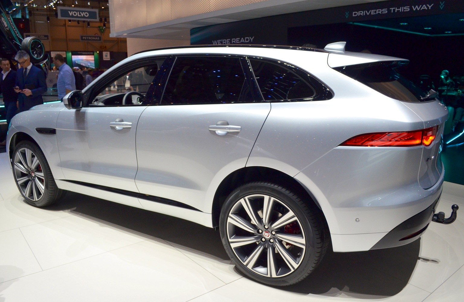 Side view of SUV with alloy wheels and sleek aerodynamic body.