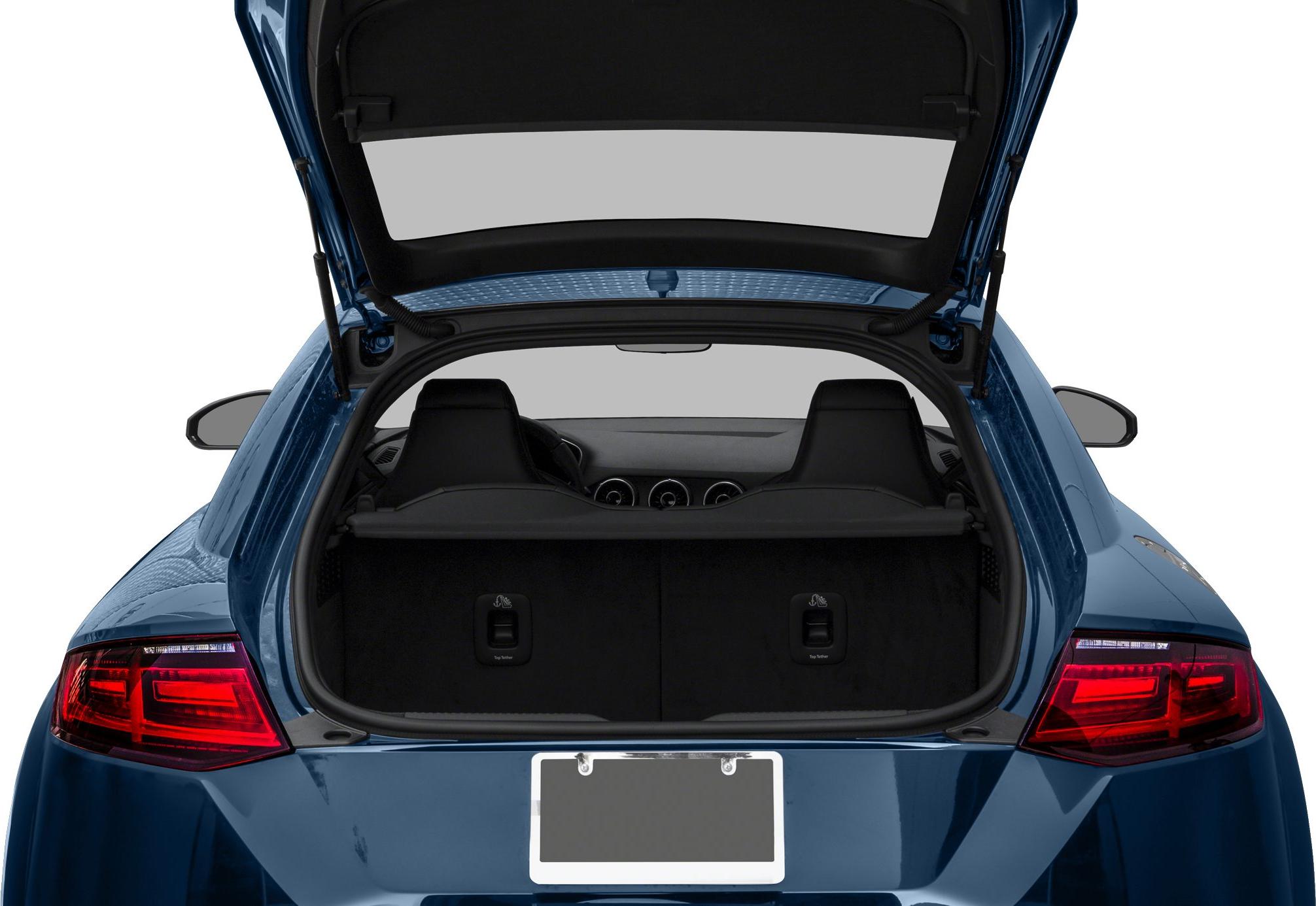 Open rear trunk with visible cargo space and rear interior seats of a sports coupe.