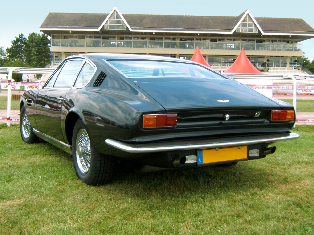 Rear design and wire wheels of a classic 1967 sports coupe