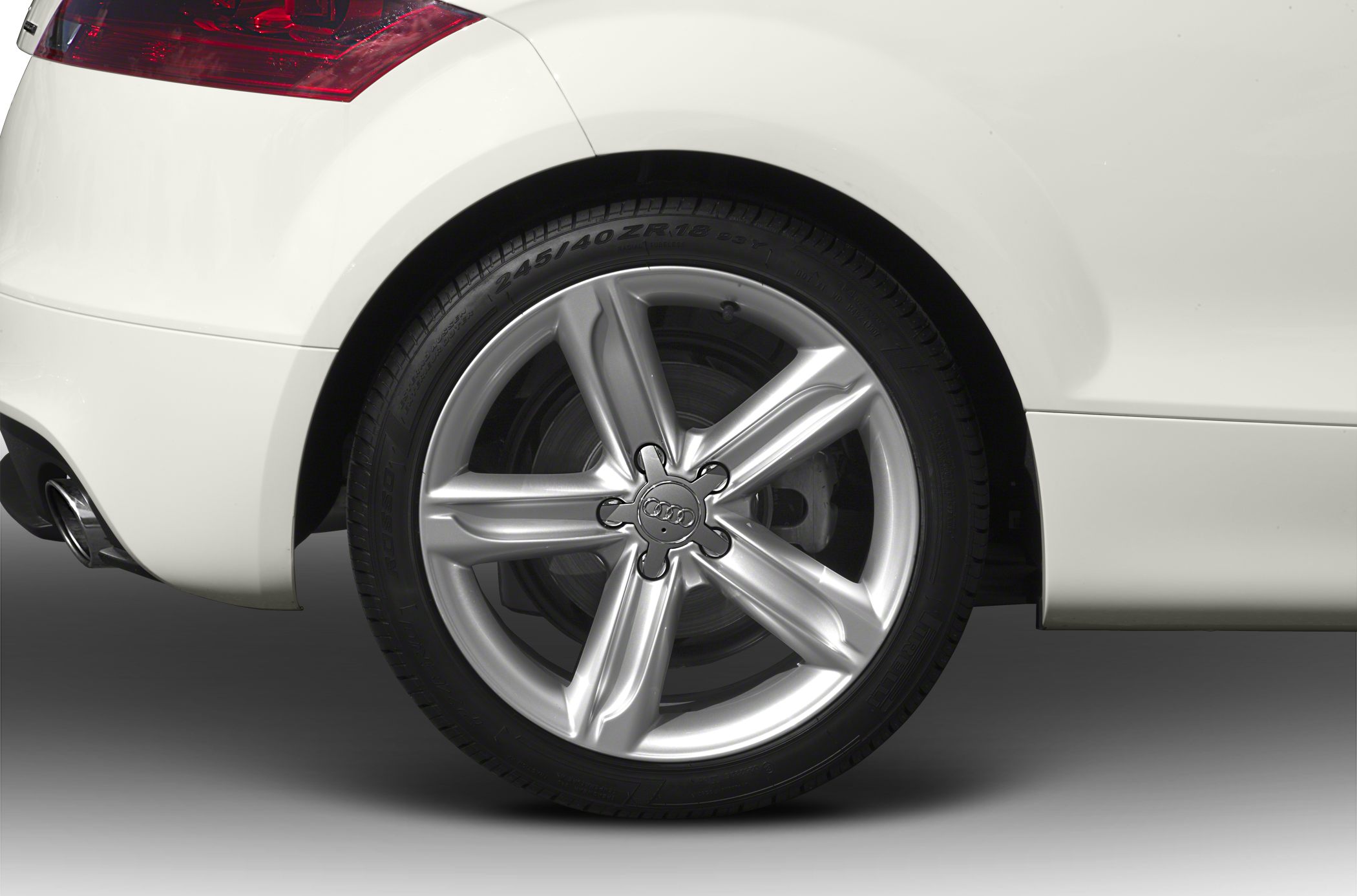 Closeup of alloy wheel and tire on car rear side