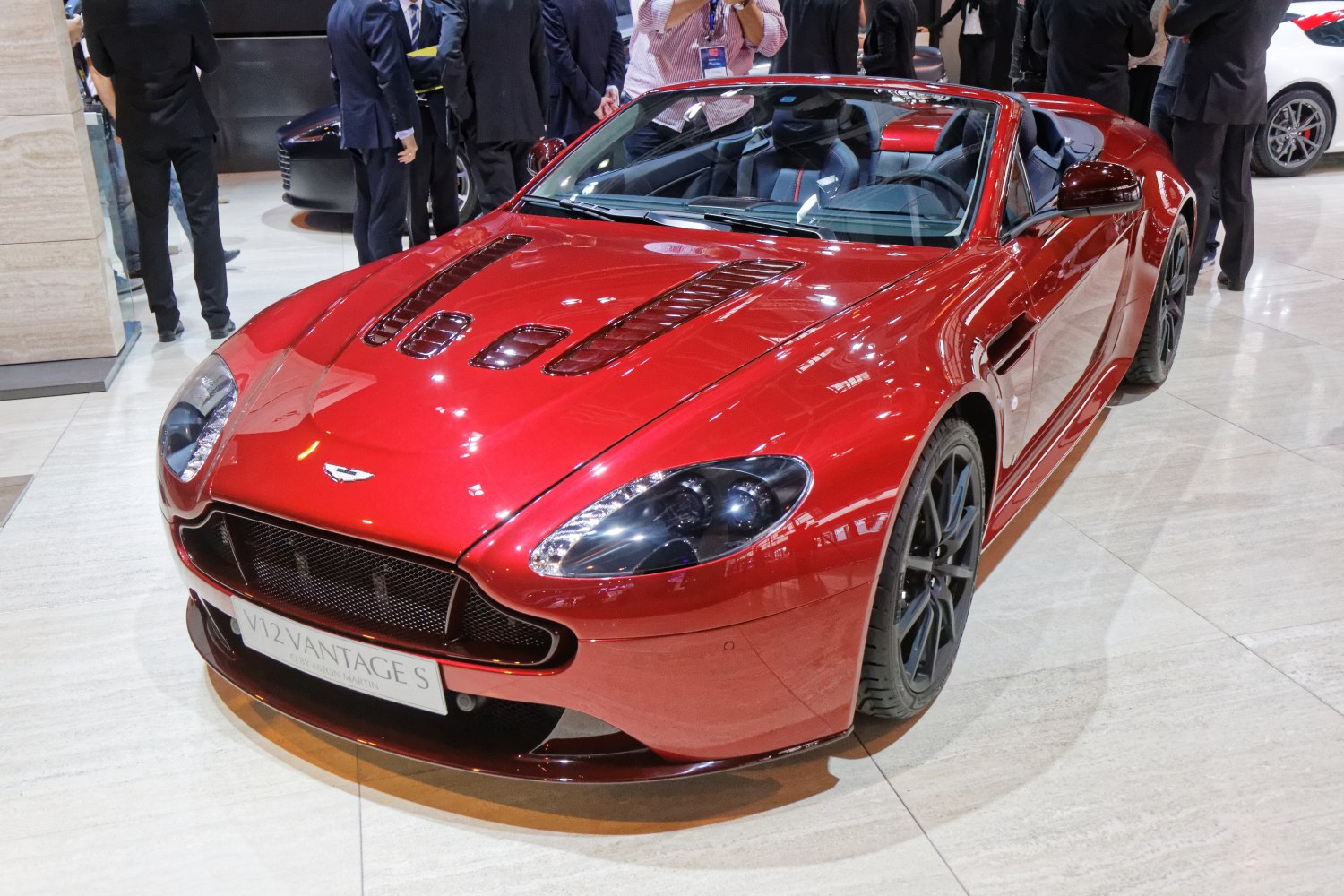 Red convertible with hood vents and aerodynamic sleek body