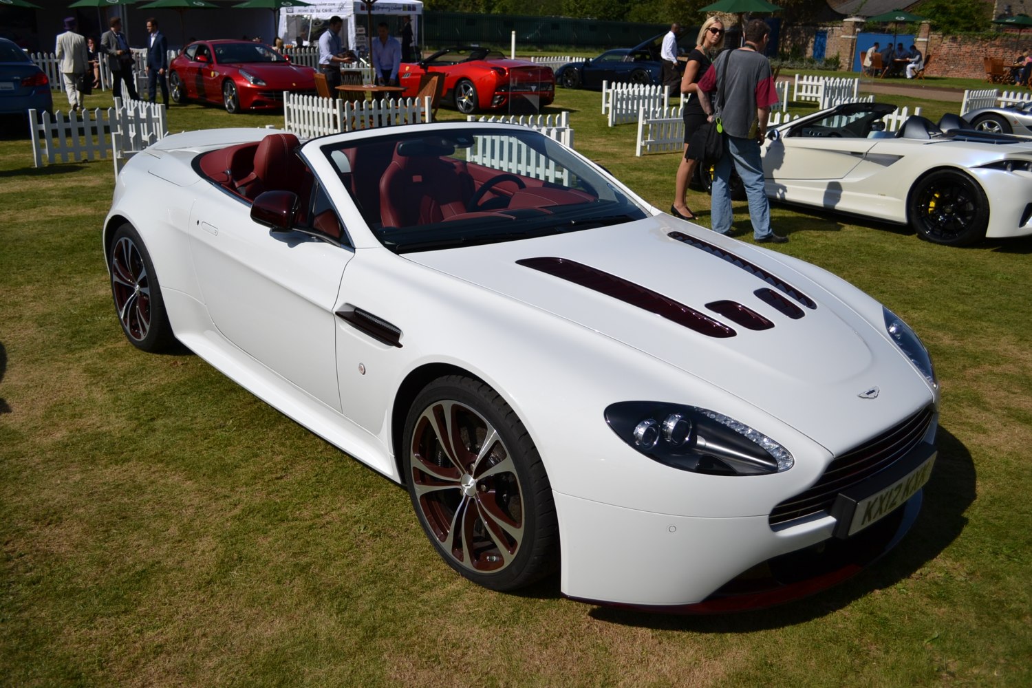 Convertible sports car with custom hood vents and distinctive wheels