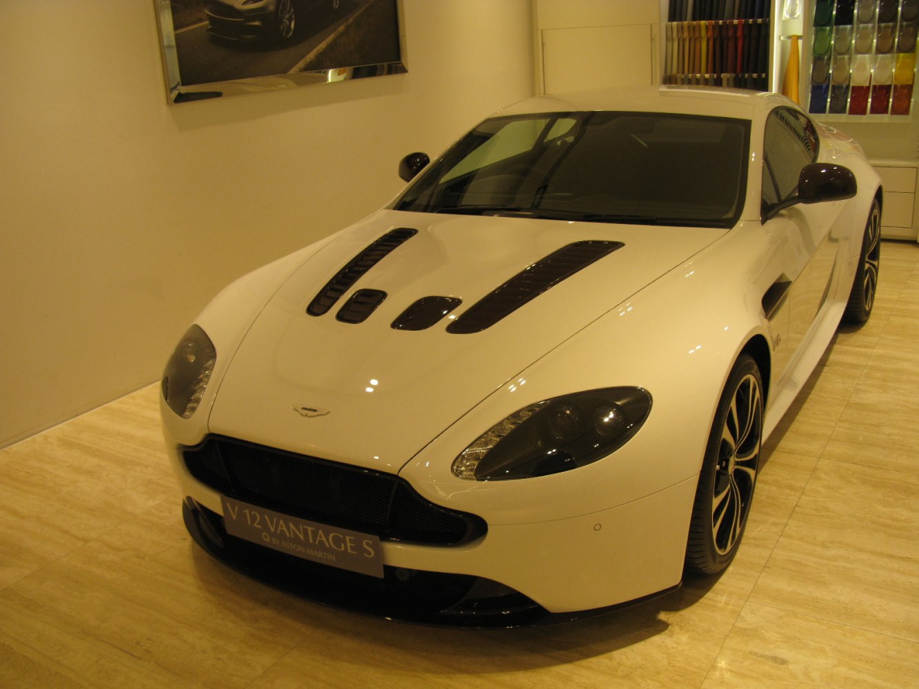 Front angled view with distinctive hood vents and black alloy wheels