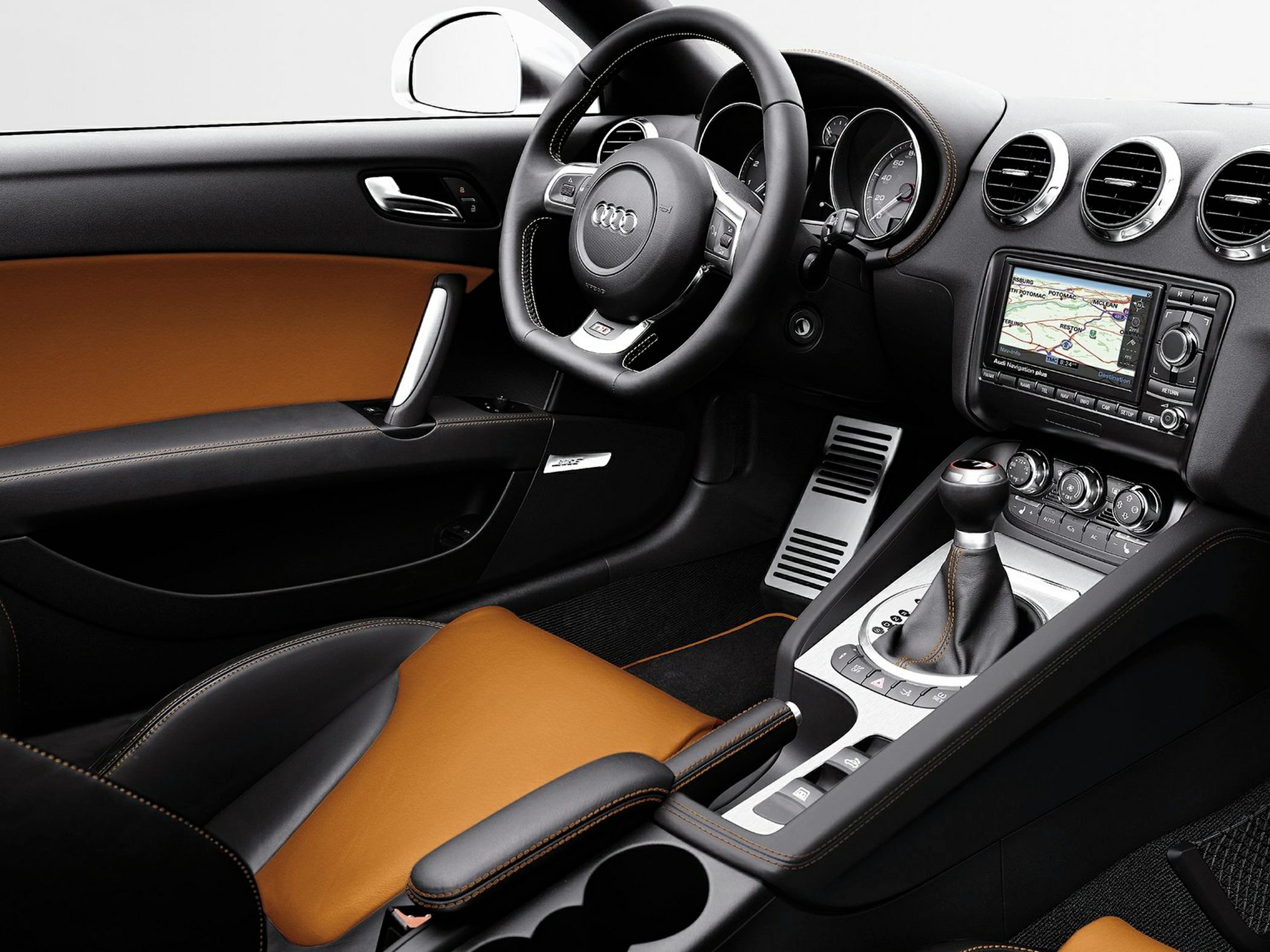 Leather interior with navigation system and manual transmission in a sports coupe