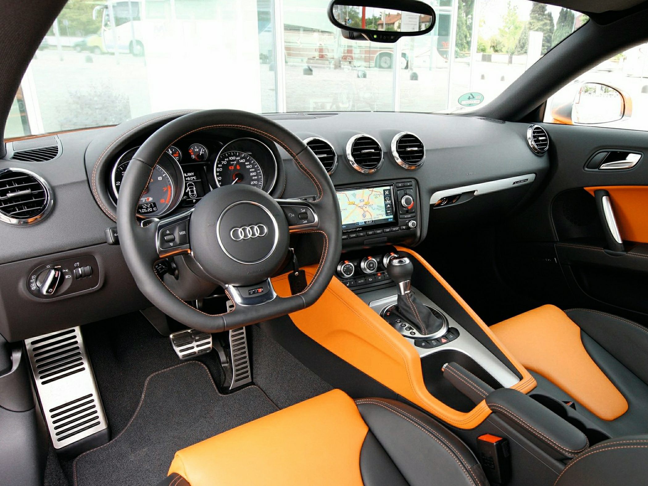 Audi TTS Coupe interior with orange accents, dashboard, steering wheel