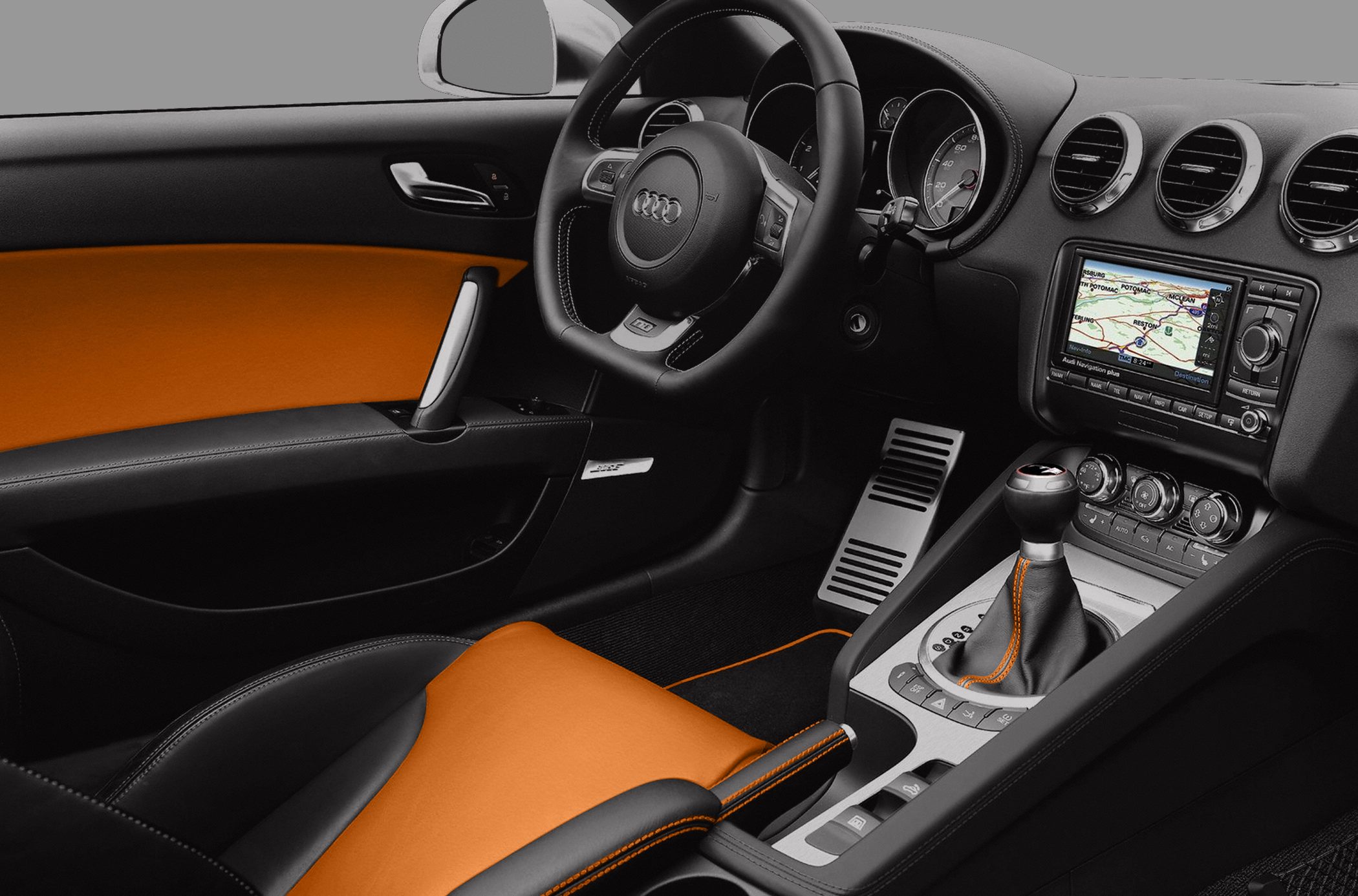 Dashboard with navigation, orange-accented seats and door panel