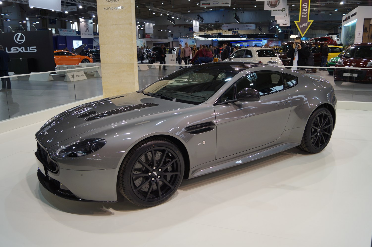 Grey sports coupe with black multi-spoke wheels