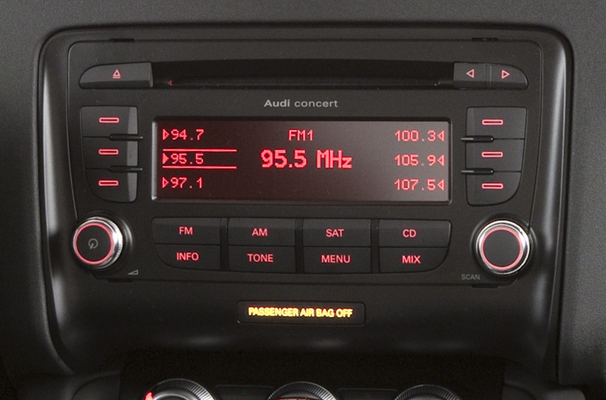 Close-up of Audi concert radio system with FM display and control buttons