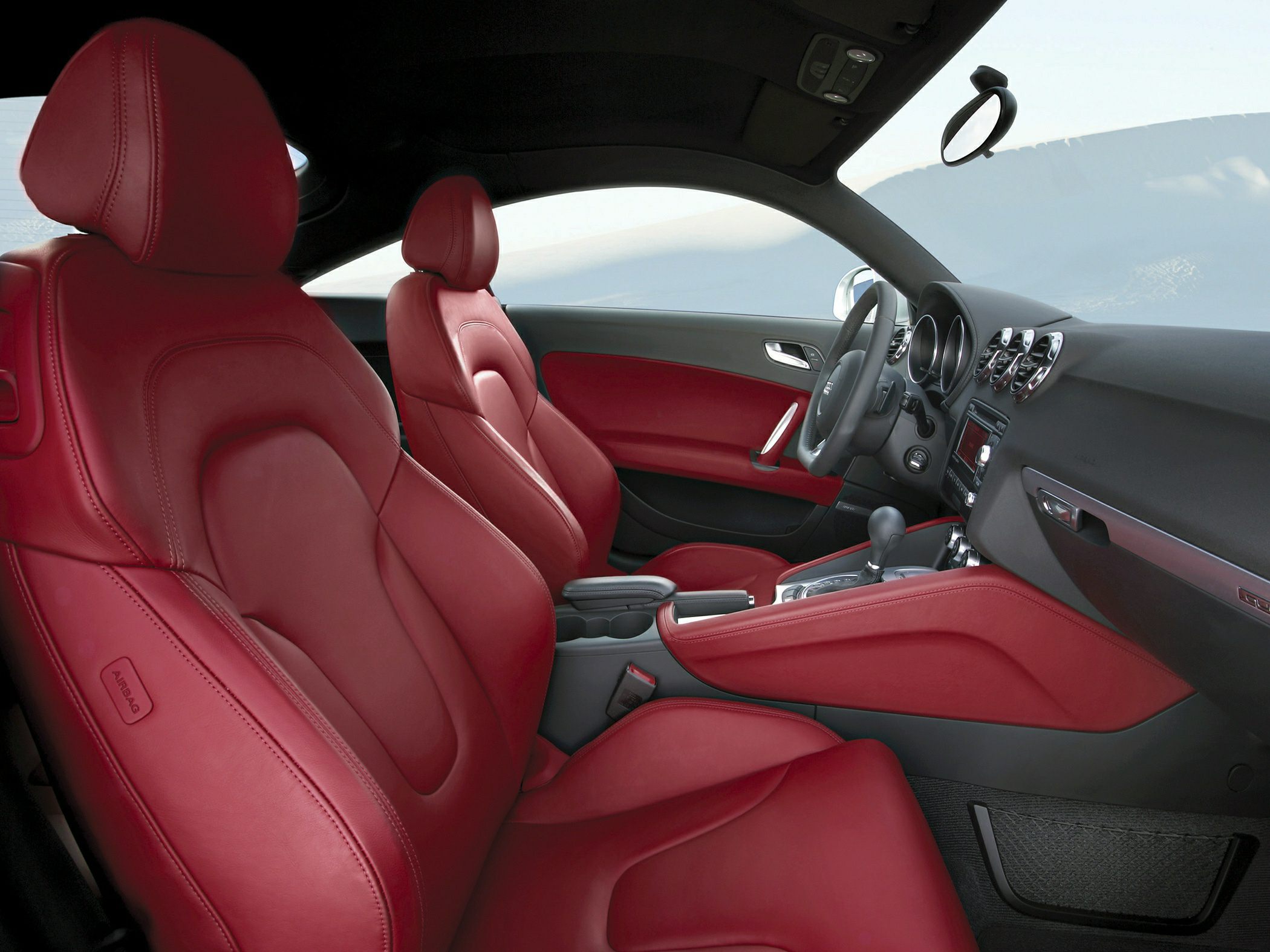 Red leather seats and sporty car interior design