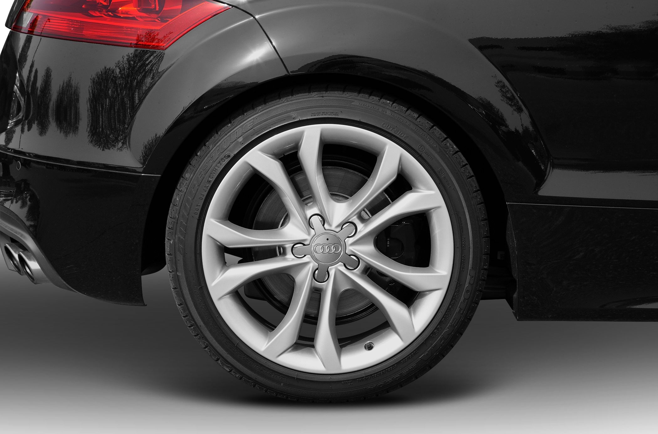 Rear wheel with alloy rim and tail light detail