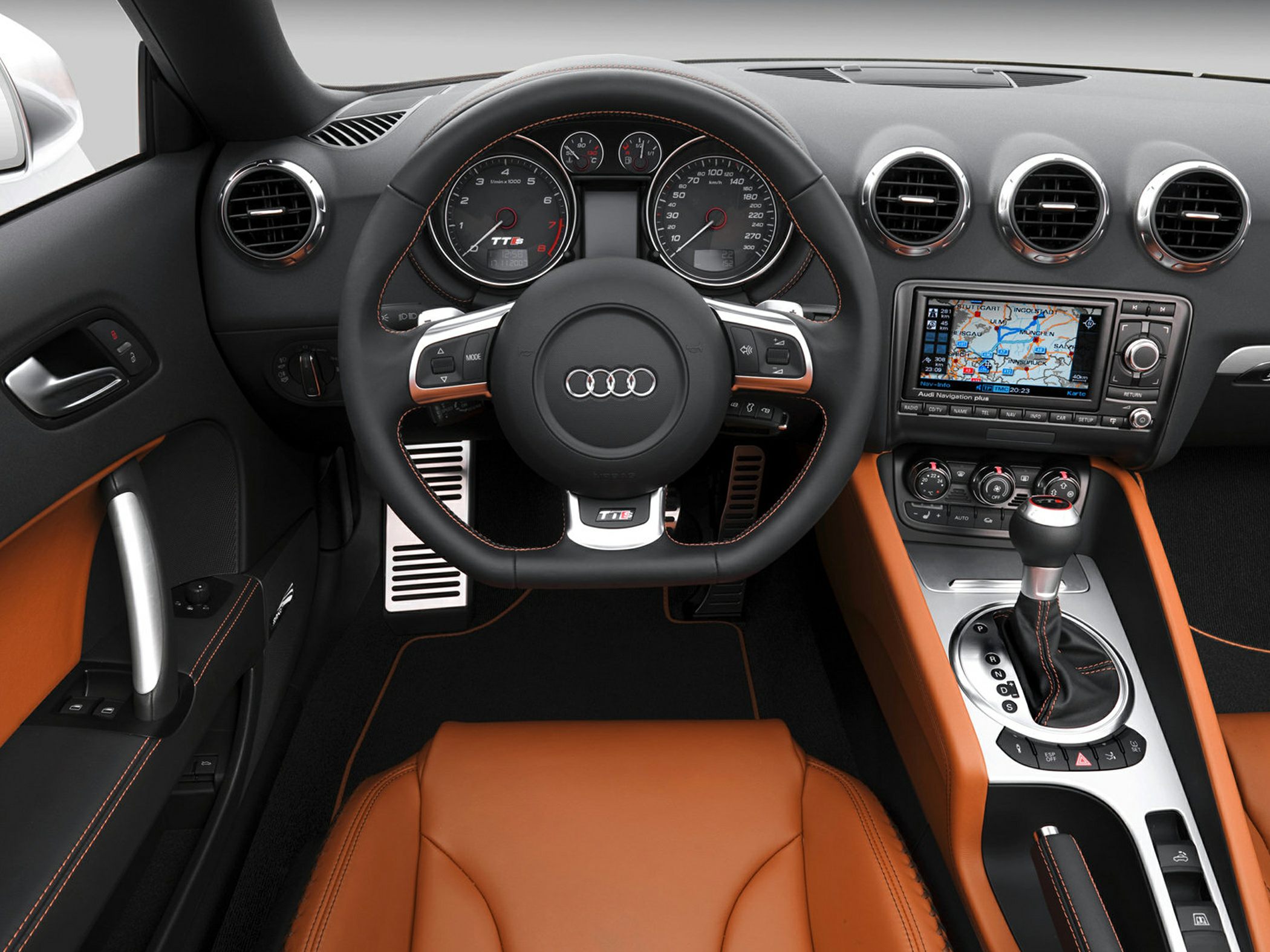 Sporty steering wheel, navigation system, premium leather seats, automatic gear shifter